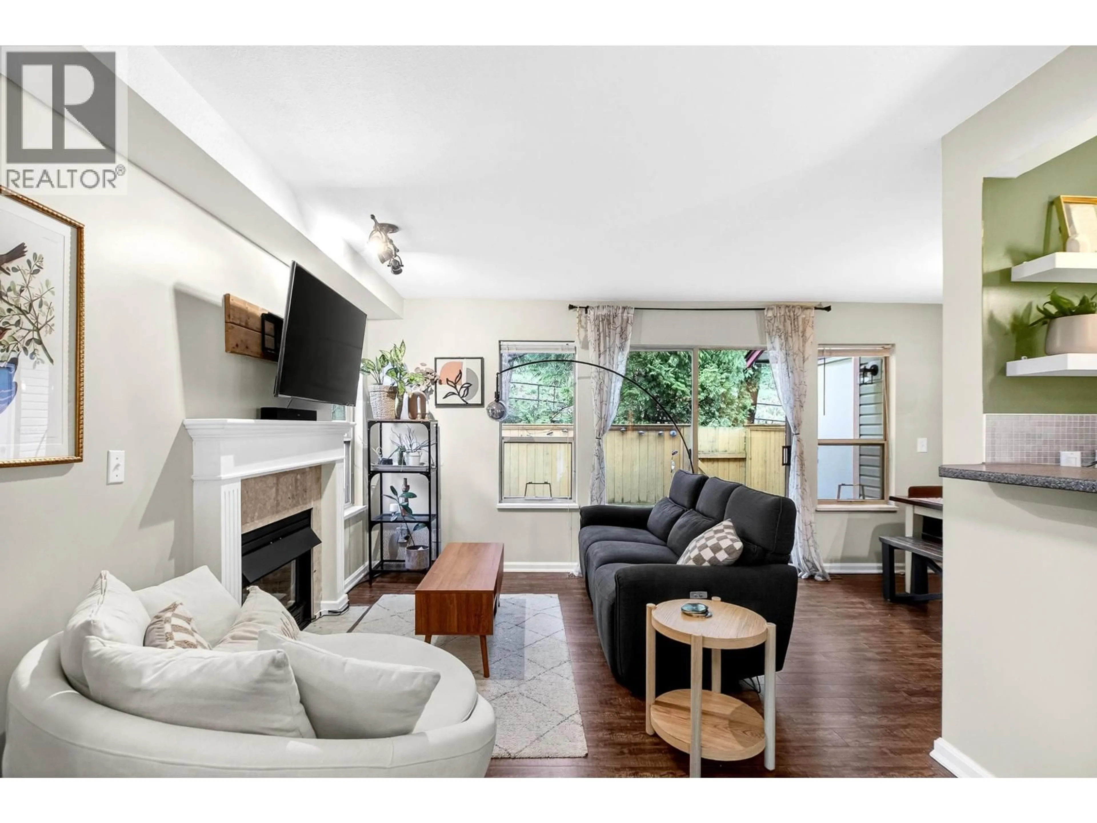Living room with furniture, wood/laminate floor for 12 - 21960 RIVER ROAD, Maple Ridge British Columbia V2X2C3