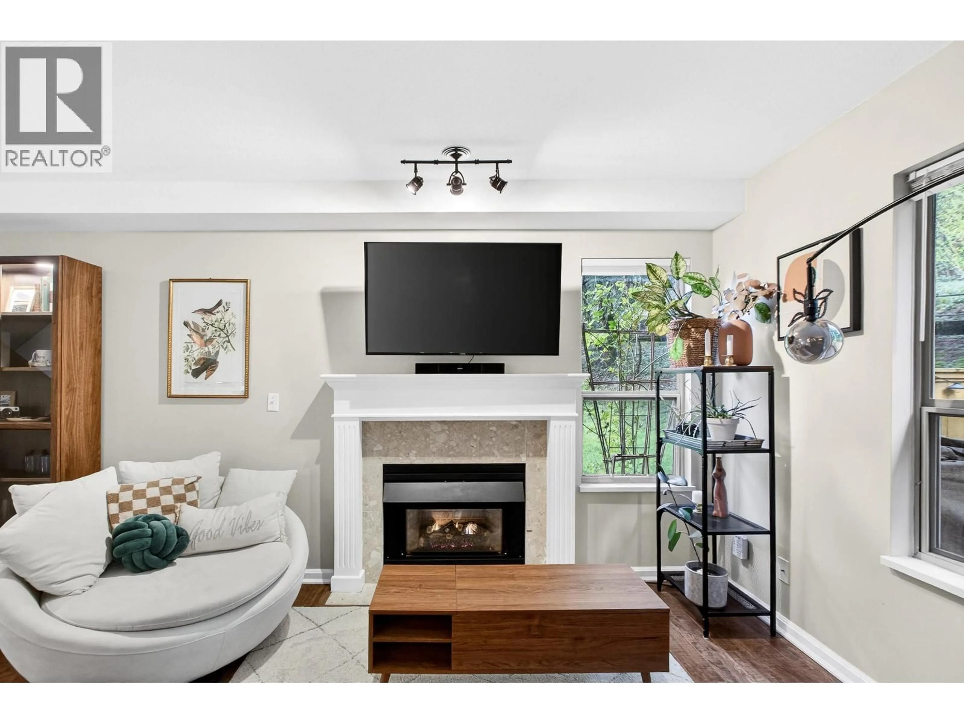 Living room with furniture, wood/laminate floor for 12 - 21960 RIVER ROAD, Maple Ridge British Columbia V2X2C3
