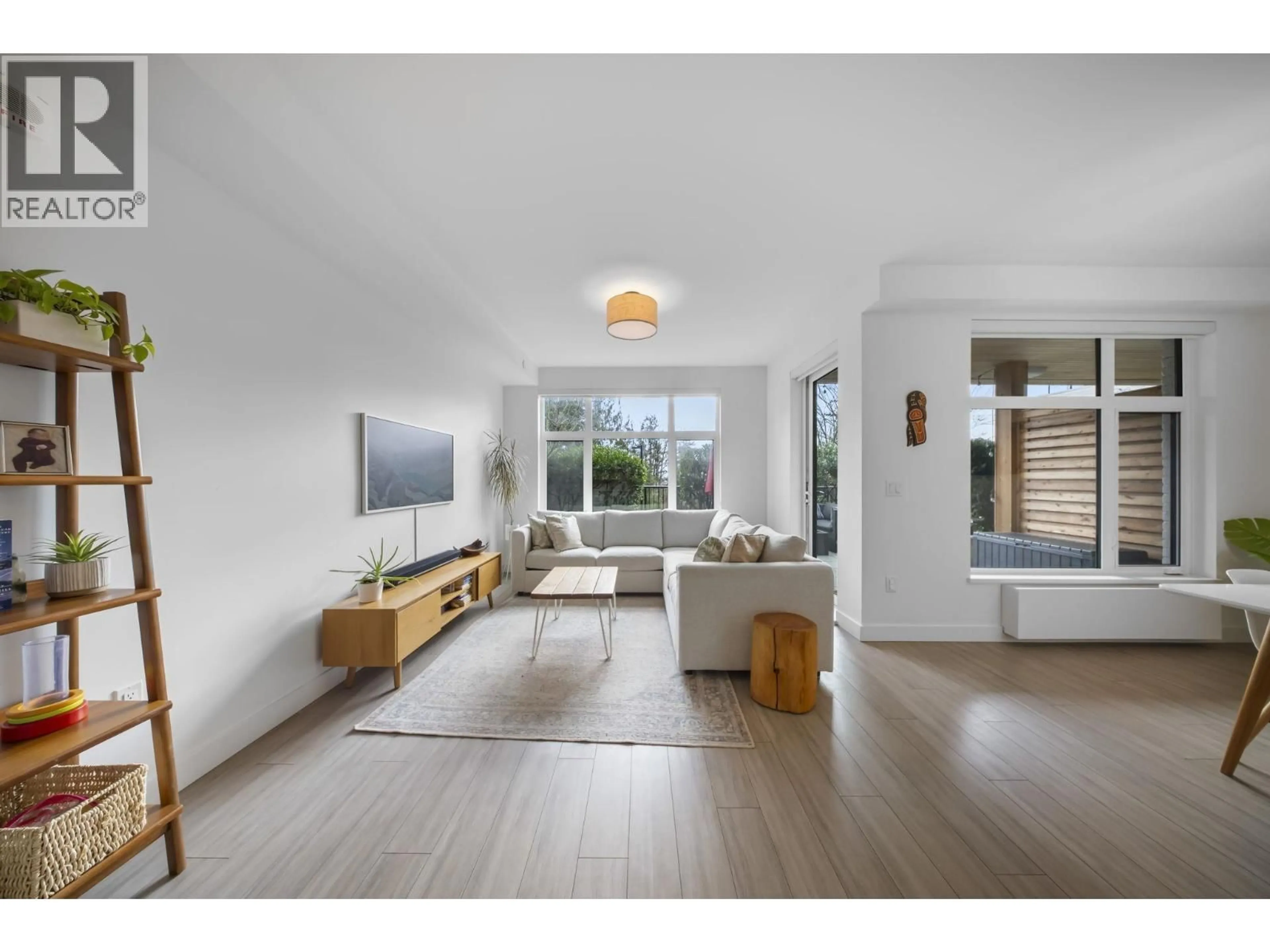 Living room with furniture, wood/laminate floor for 110 - 707 3RD STREET, North Vancouver British Columbia V7L1G8