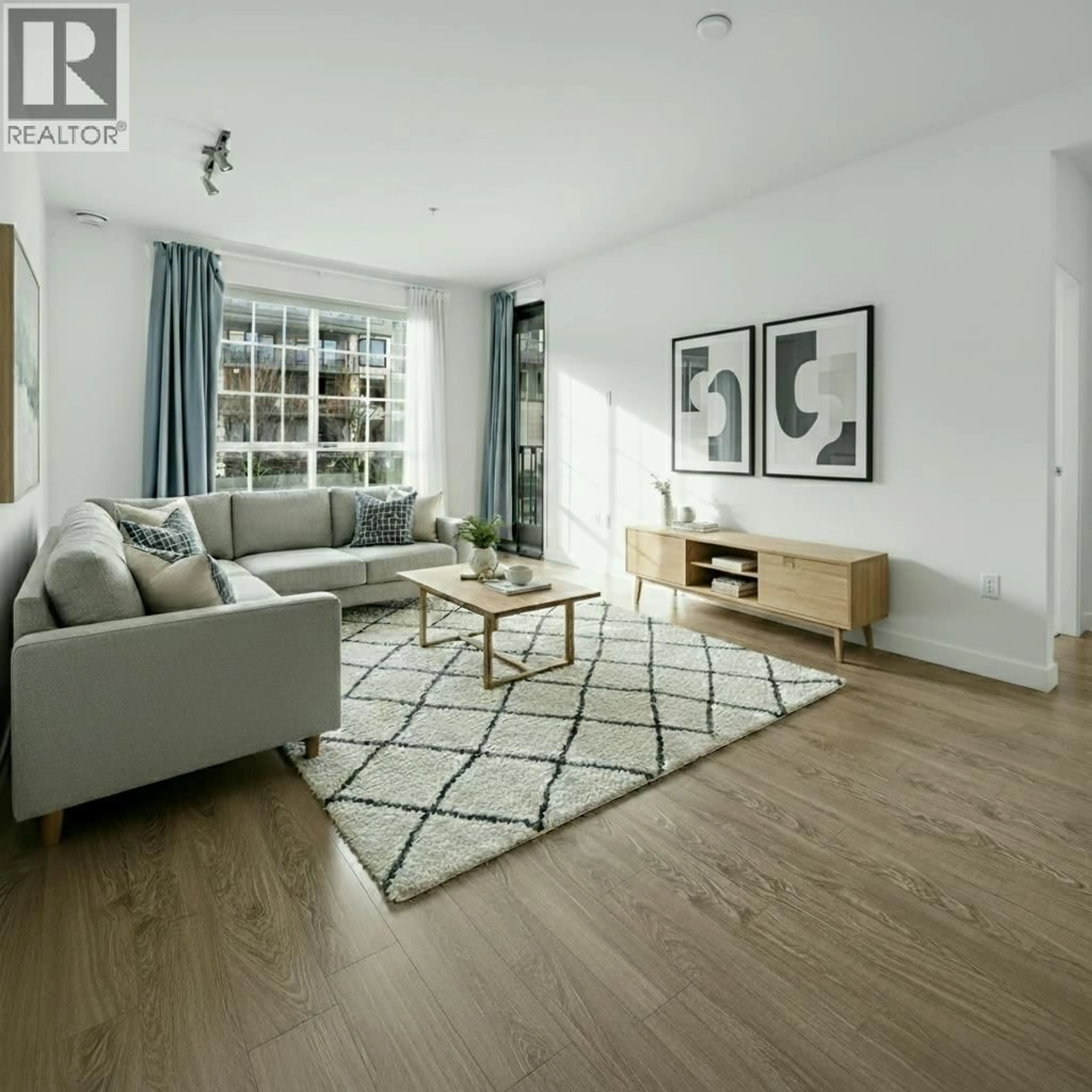 Living room with furniture, wood/laminate floor for 208 - 608 COMO LAKE AVENUE, Coquitlam British Columbia V3J0B2