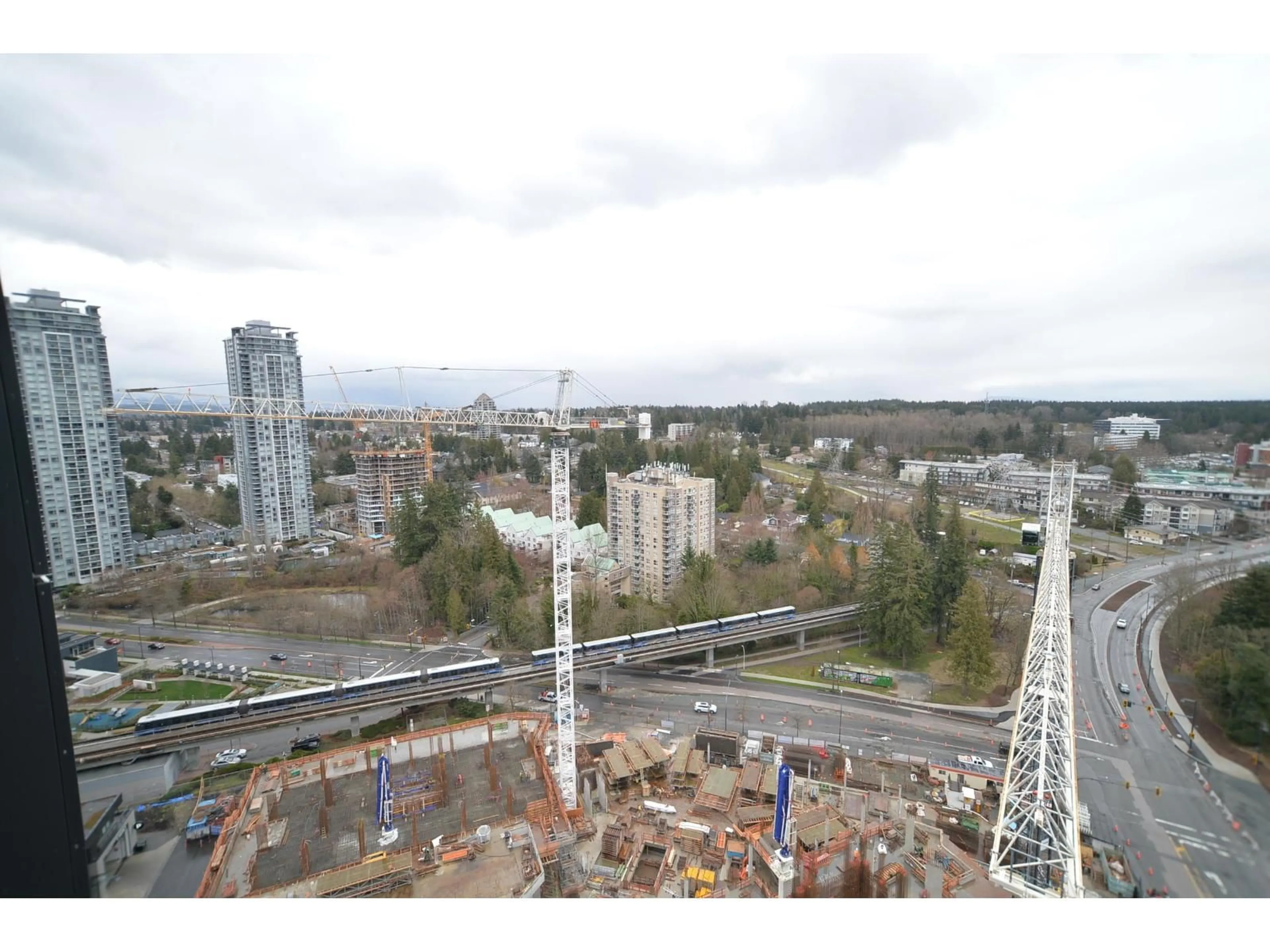 A pic from outside/outdoor area/front of a property/back of a property/a pic from drone, city buildings view from balcony for 2408 - 13655 FRASER HWY, Surrey British Columbia V3T0P8