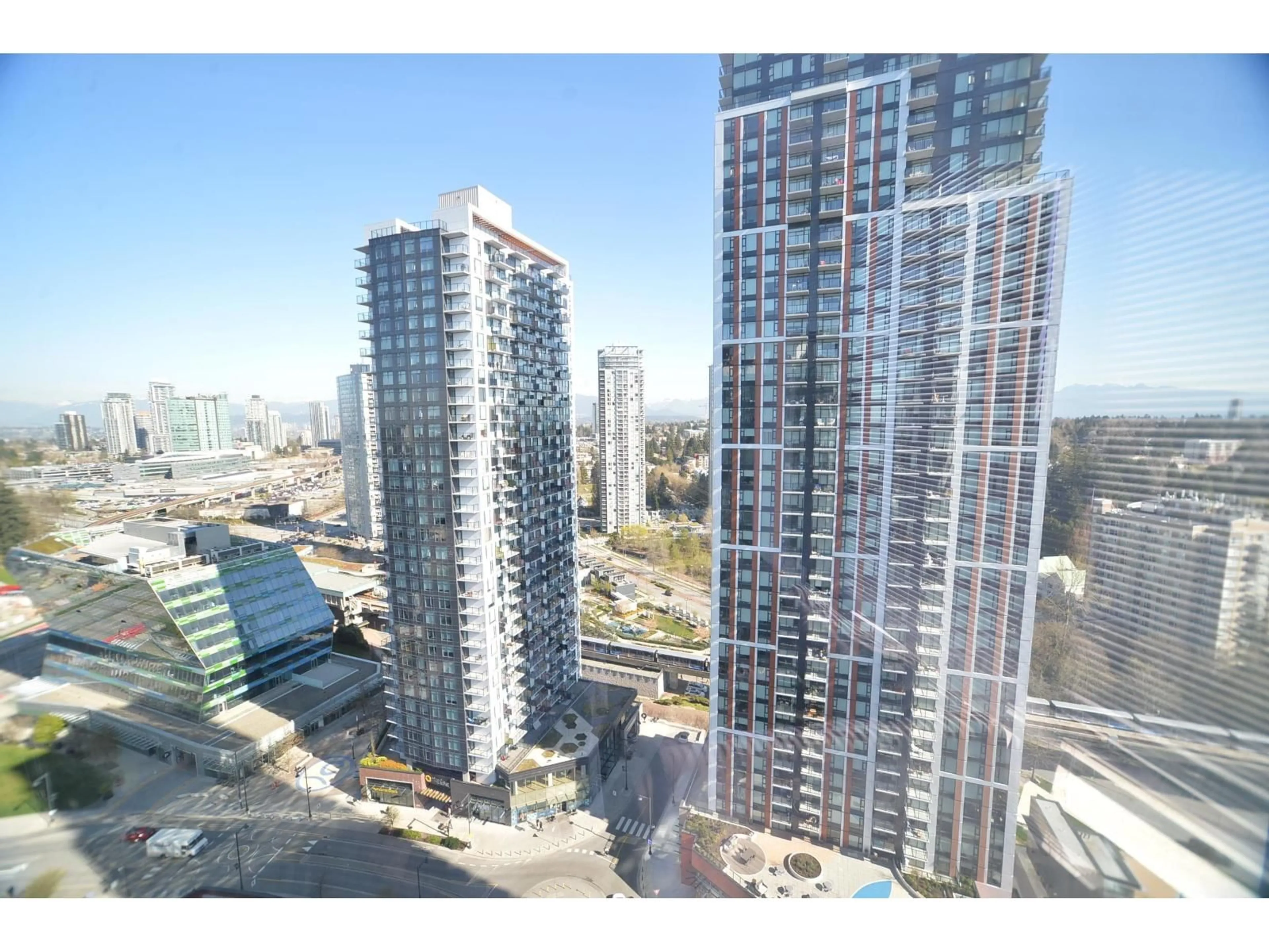 A pic from outside/outdoor area/front of a property/back of a property/a pic from drone, city buildings view from balcony for 2408 - 13655 FRASER HWY, Surrey British Columbia V3T0P8