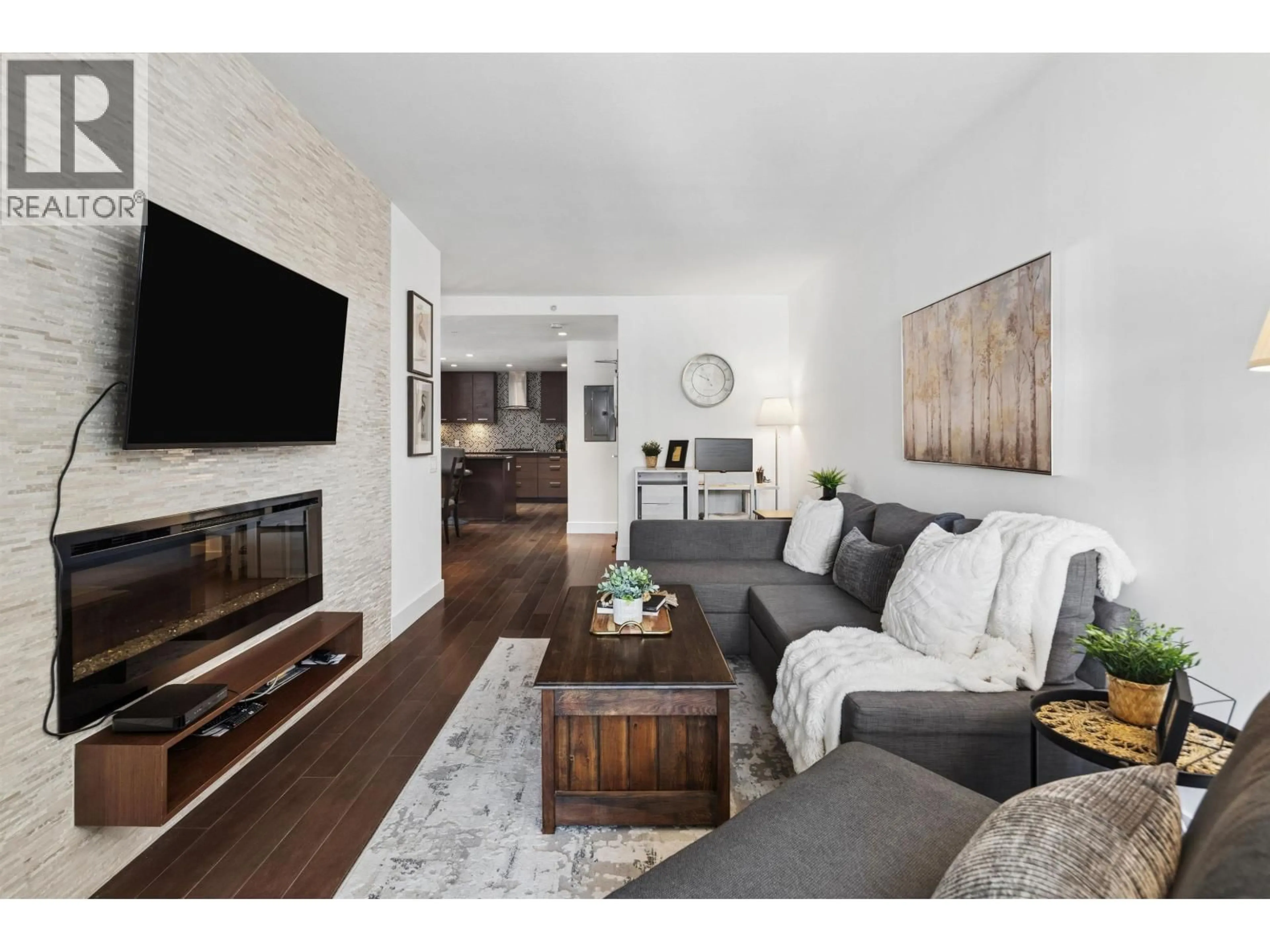 Living room with furniture, wood/laminate floor for 406 - 210 13 STREET, North Vancouver British Columbia V7M1N7