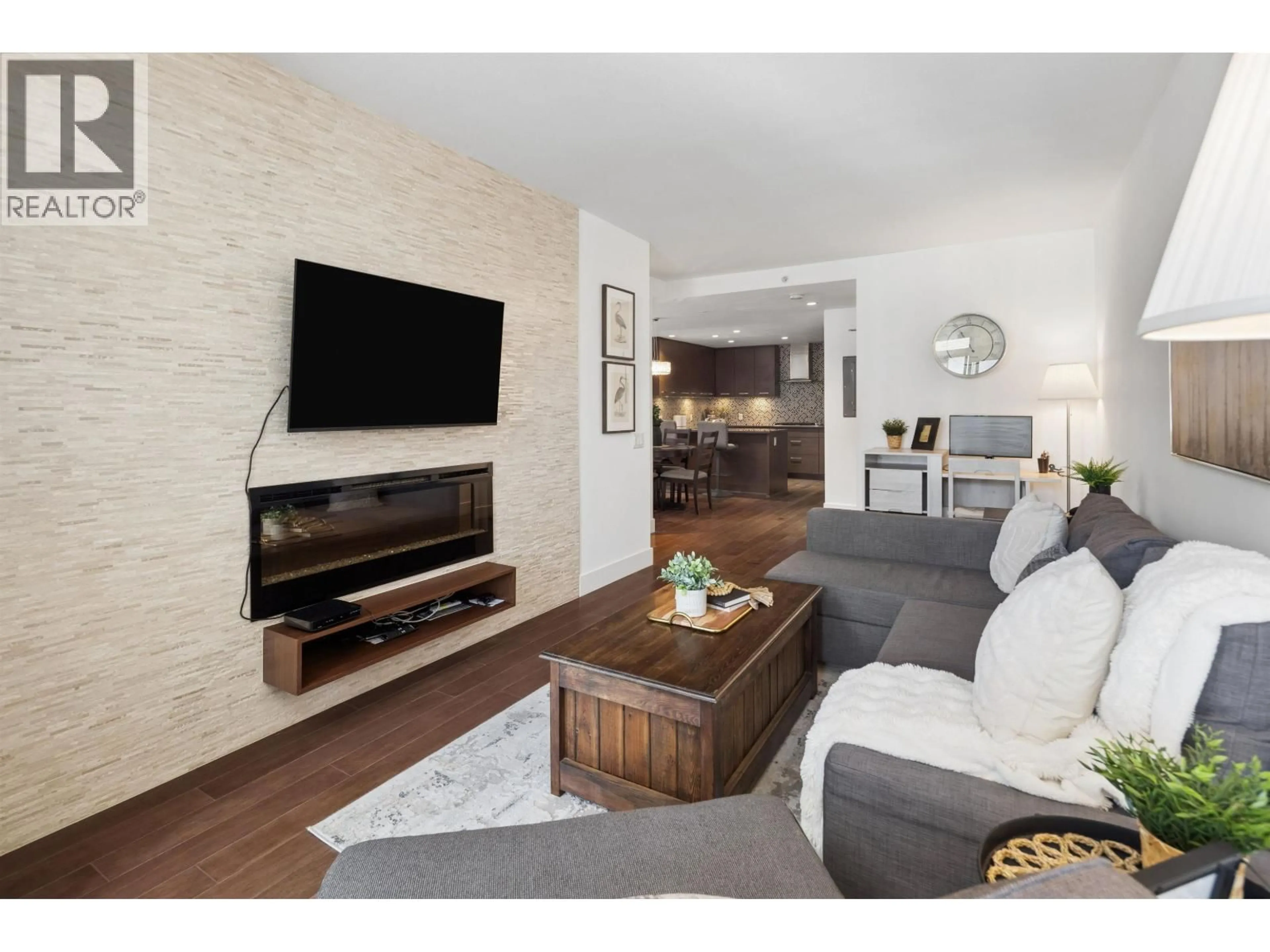 Living room with furniture, wood/laminate floor for 406 - 210 13 STREET, North Vancouver British Columbia V7M1N7