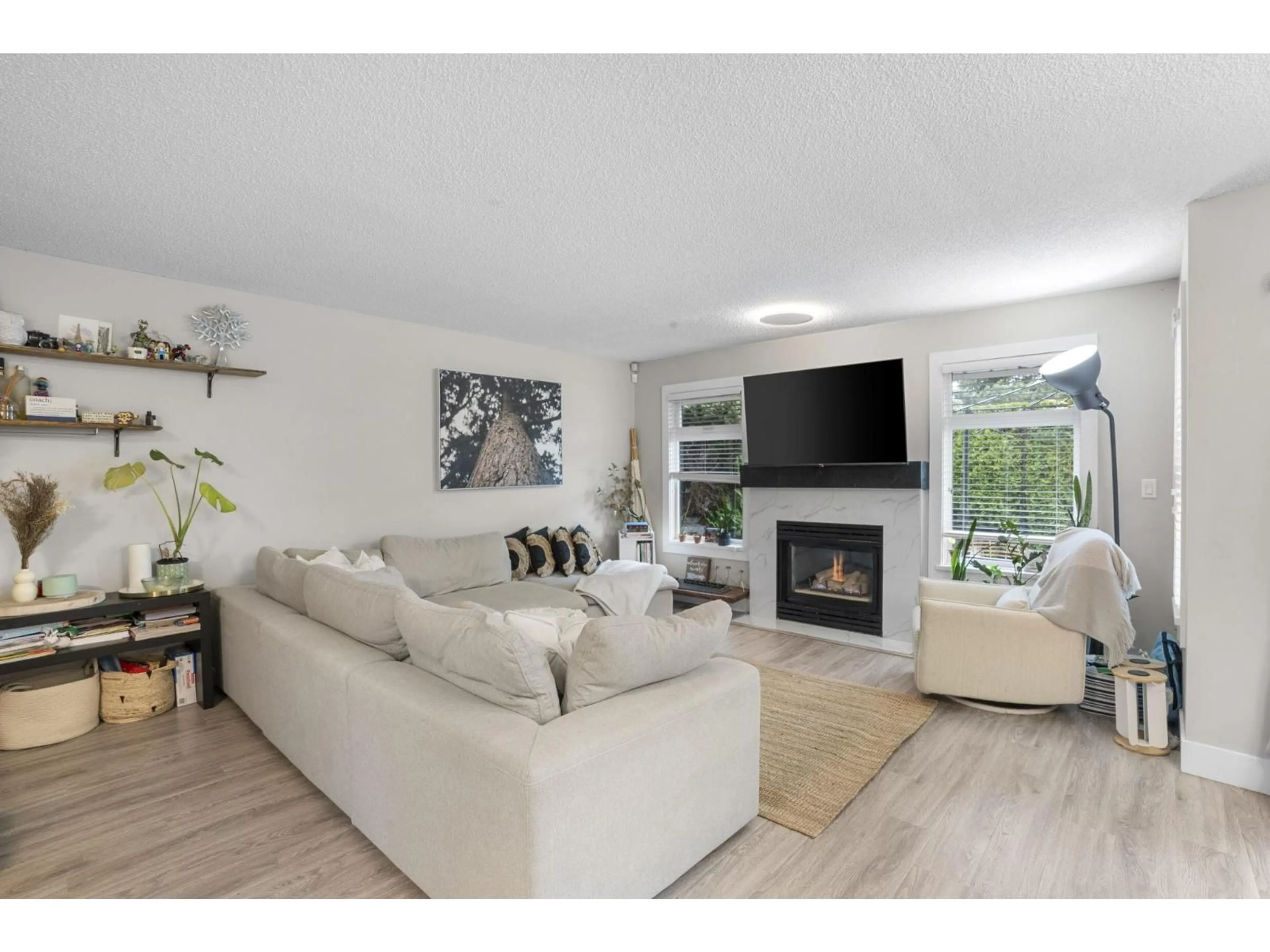 Living room with furniture, wood/laminate floor for 49 - 9045 WALNUT GROVE DRIVE, Langley British Columbia V1M2E1