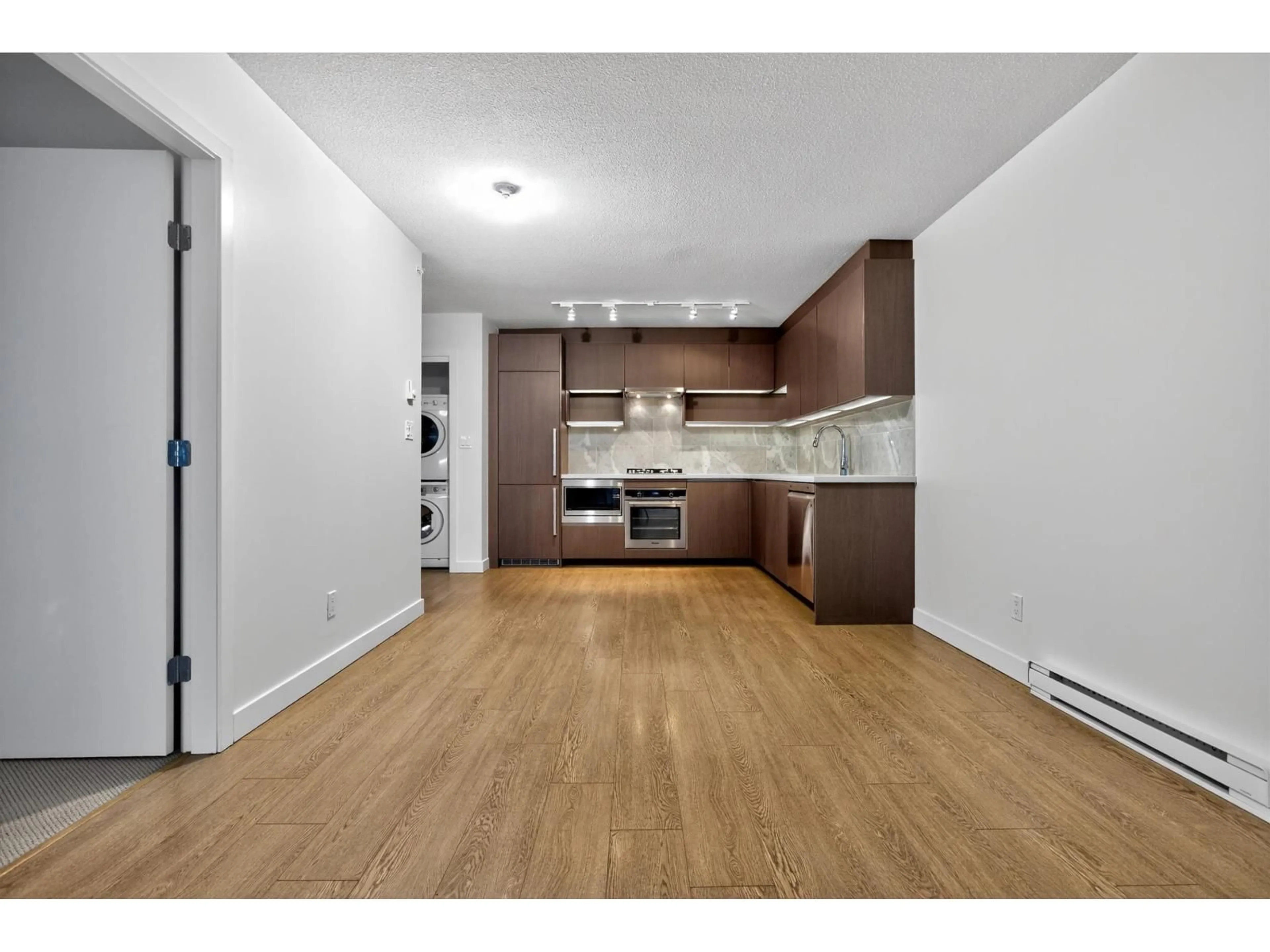 Open concept kitchen, wood/laminate floor for 3008 - 13696 100 AVENUE, Surrey British Columbia V3T0L5
