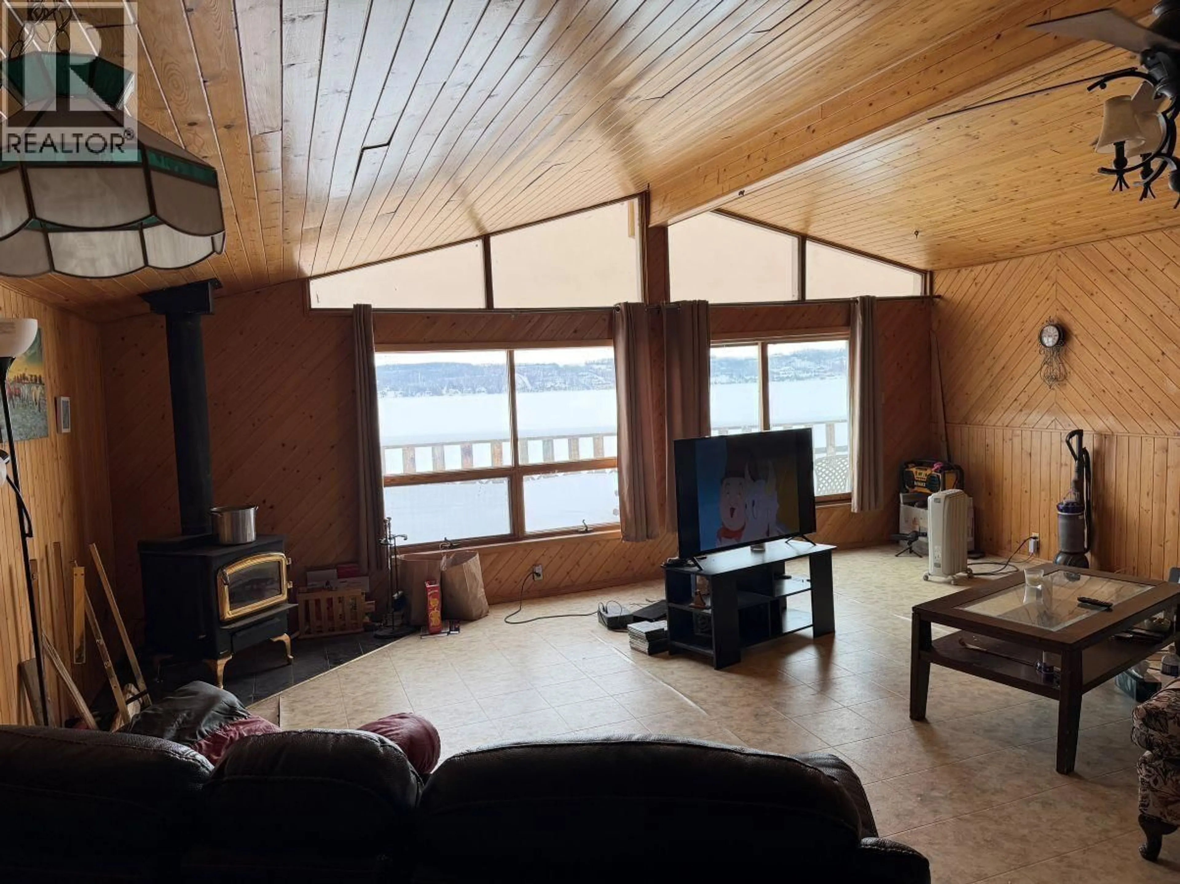 Living room with furniture, wood/laminate floor for 13234 LAKESHORE DRIVE, Charlie Lake British Columbia V0C1H0
