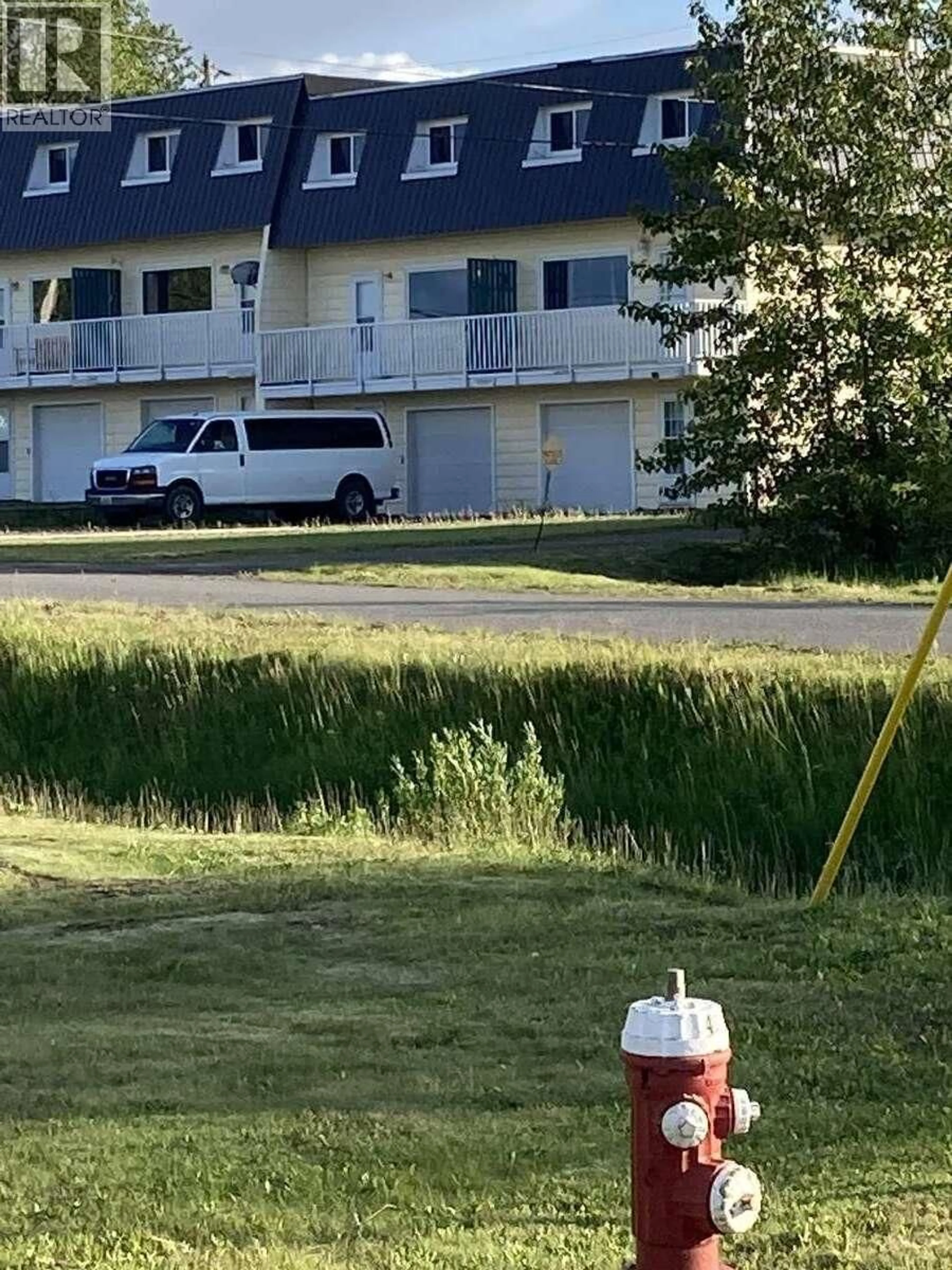 A pic from outside/outdoor area/front of a property/back of a property/a pic from drone, unknown for 12 MORRISON STREET, Granisle British Columbia V0J1W0