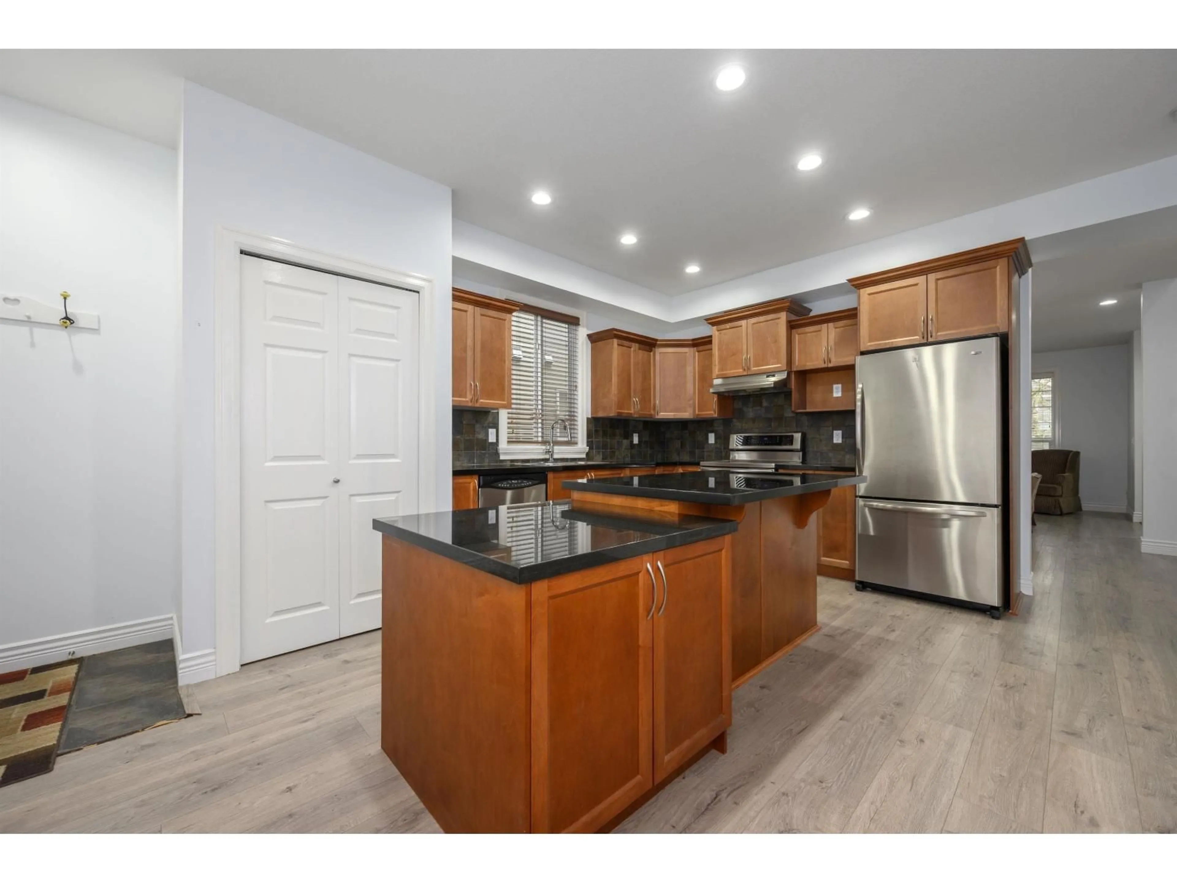 Open concept kitchen, wood/laminate floor for 19441 66 AVENUE, Surrey British Columbia V4N0C3