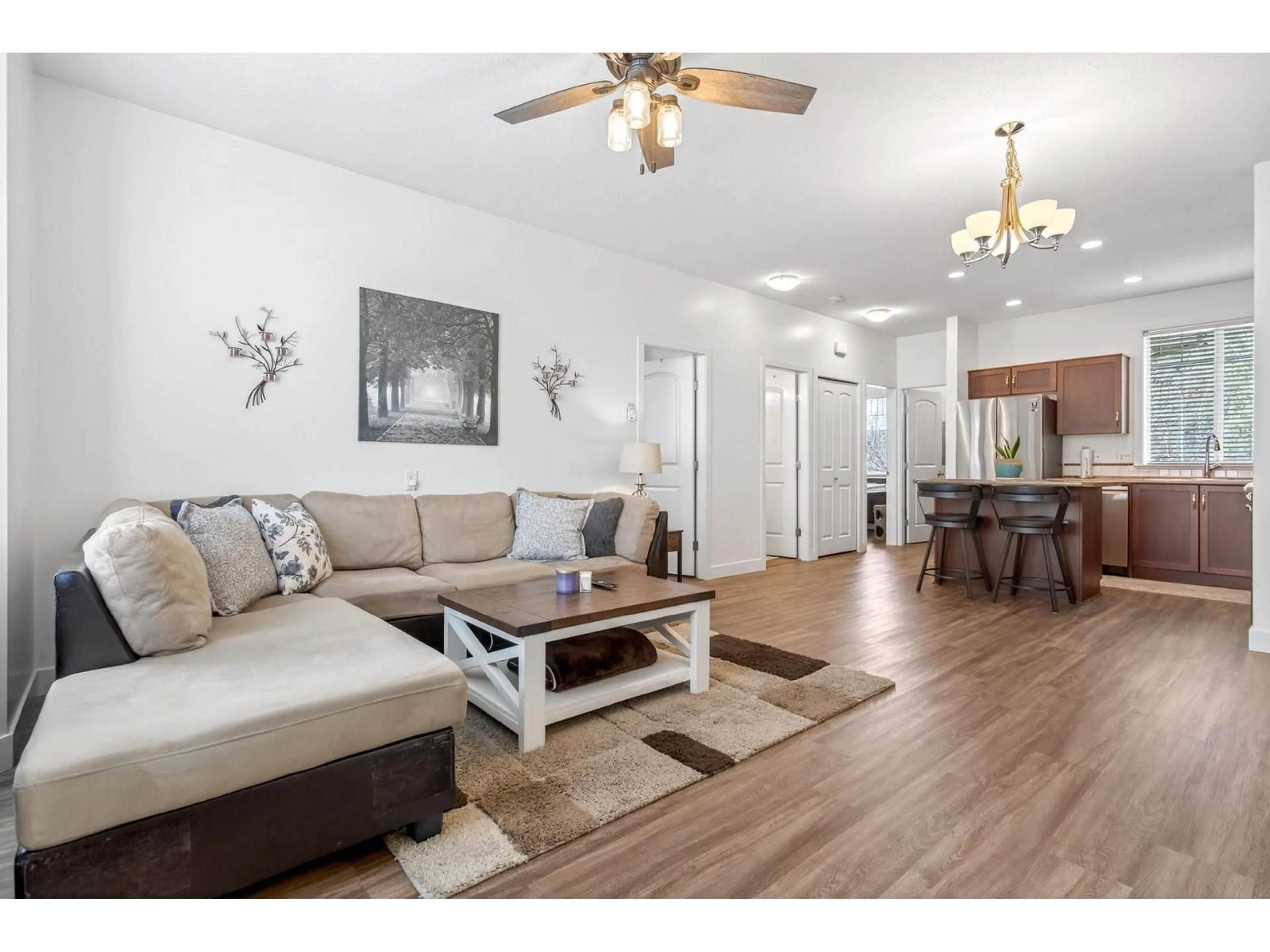 Living room with furniture, wood/laminate floor for 22 - 32501 FRASER CRESCENT, Mission British Columbia V2V1C5