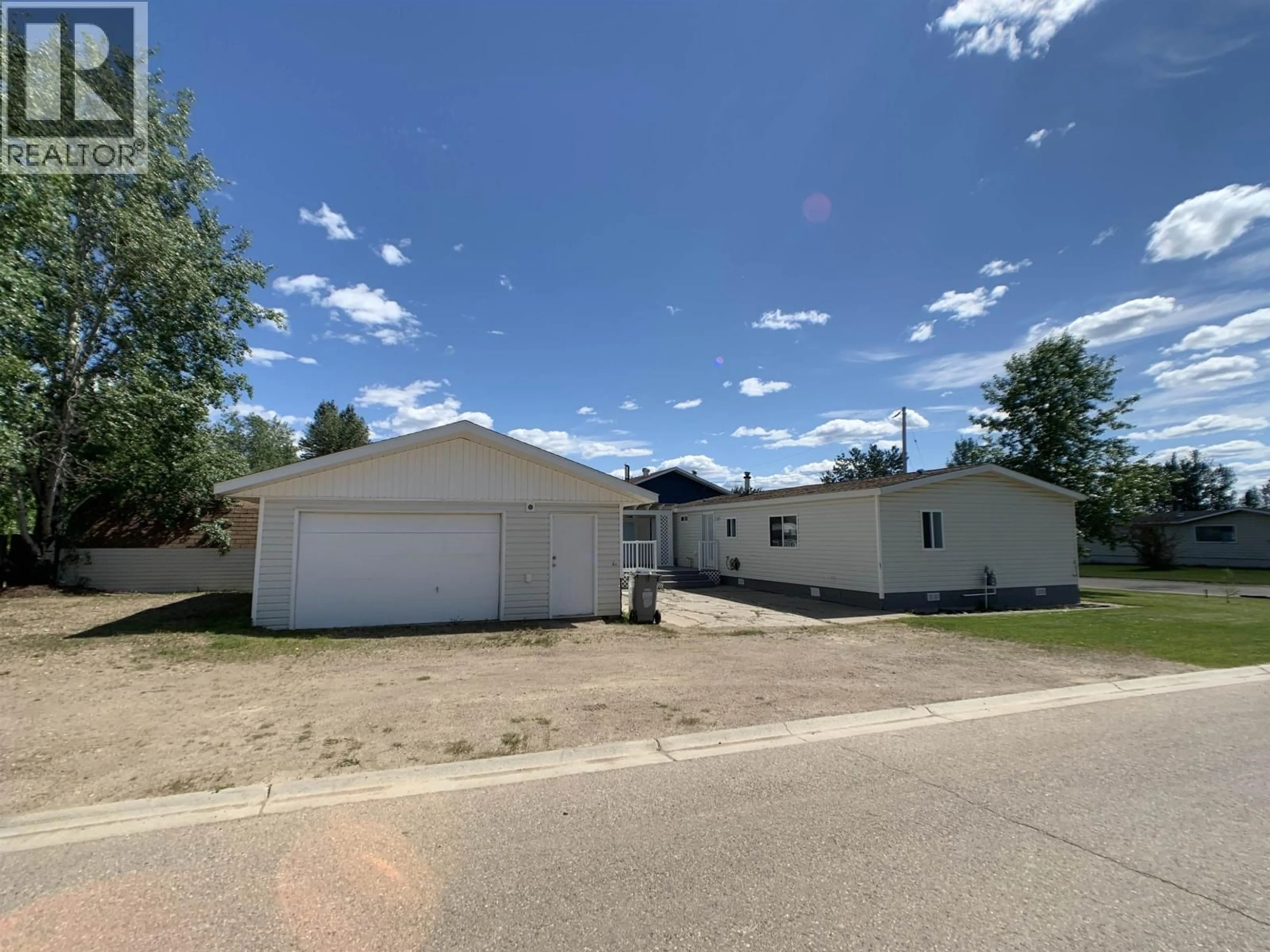 A pic from outside/outdoor area/front of a property/back of a property/a pic from drone, street for 4028 POPLAR AVENUE, Fort Nelson British Columbia V0C1R0