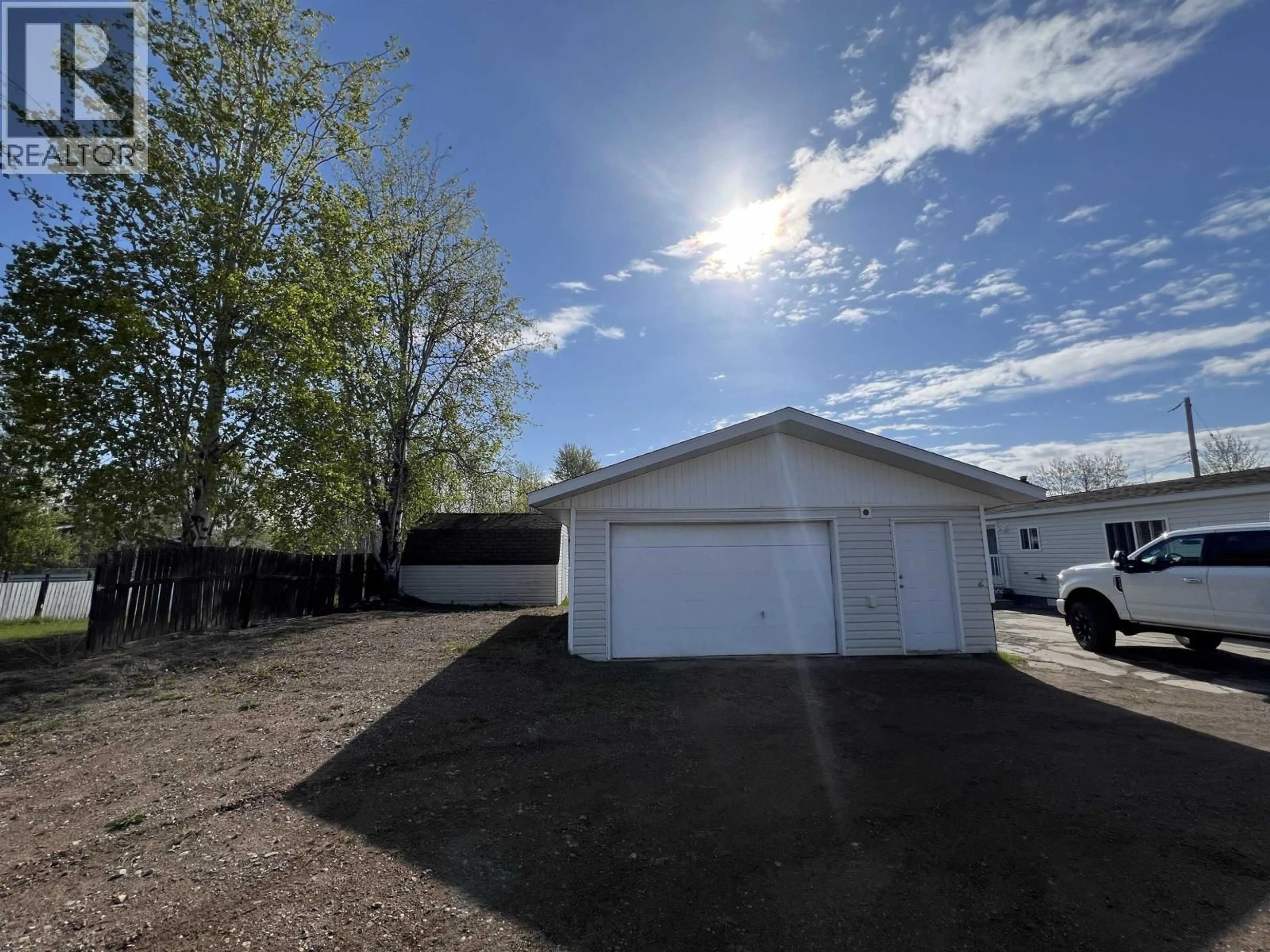 A pic from outside/outdoor area/front of a property/back of a property/a pic from drone, street for 4028 POPLAR AVENUE, Fort Nelson British Columbia V0C1R0