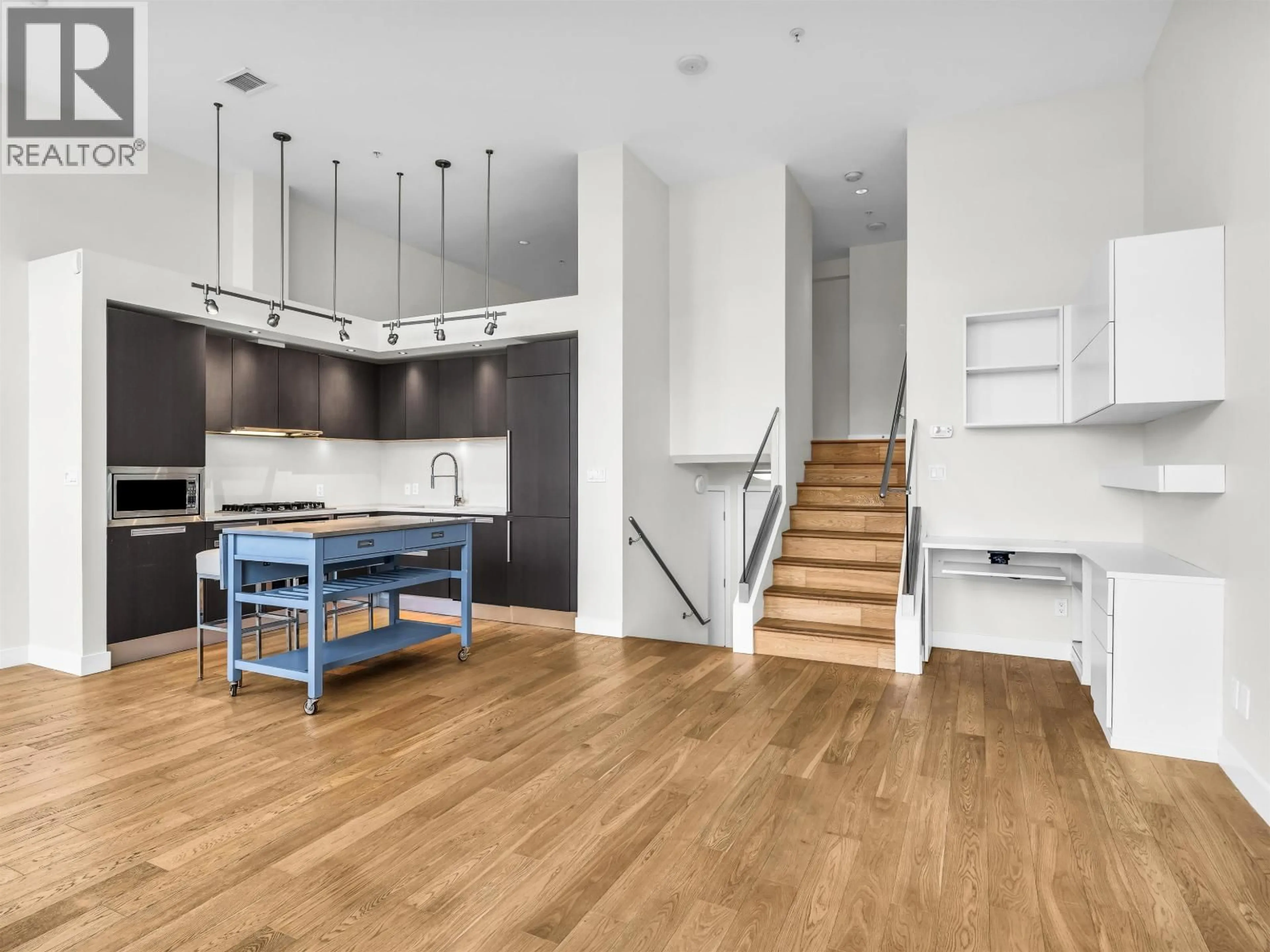 Open concept kitchen, wood/laminate floor for 296 1ST AVENUE, Vancouver British Columbia V5Y3T2