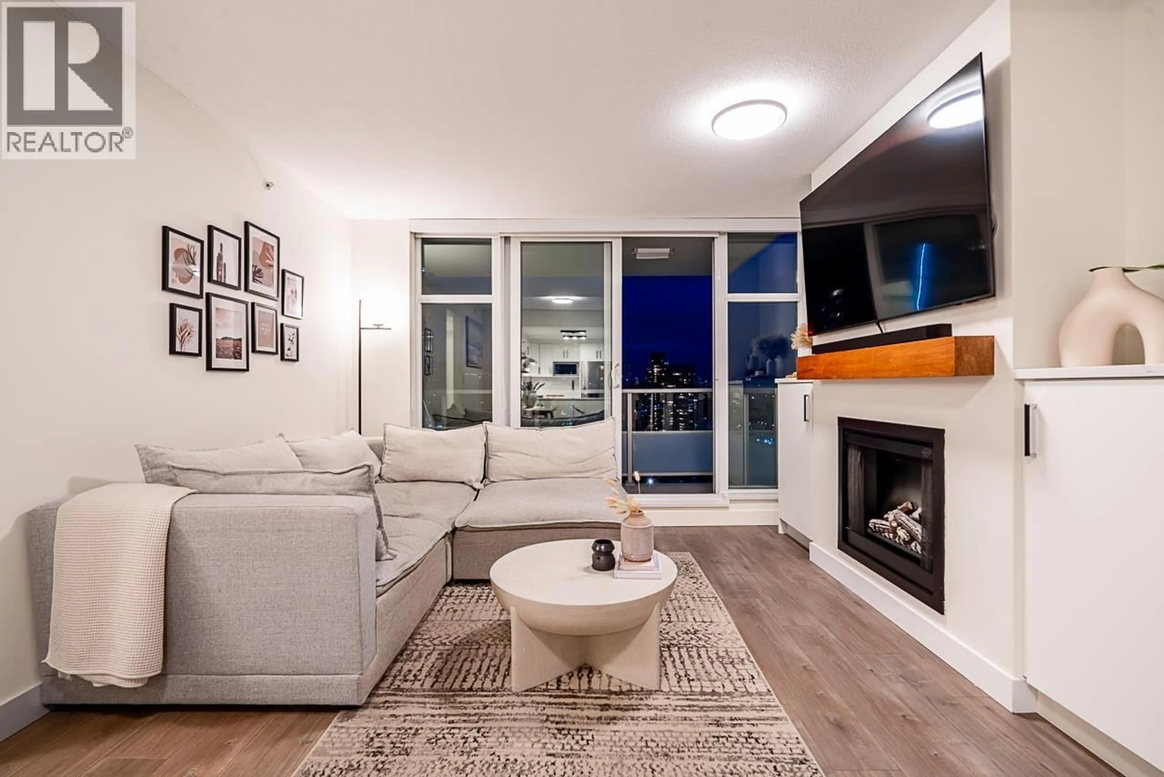 Living room with furniture, wood/laminate floor for 2903 - 2289 YUKON CRESCENT, Burnaby British Columbia V5C0B2