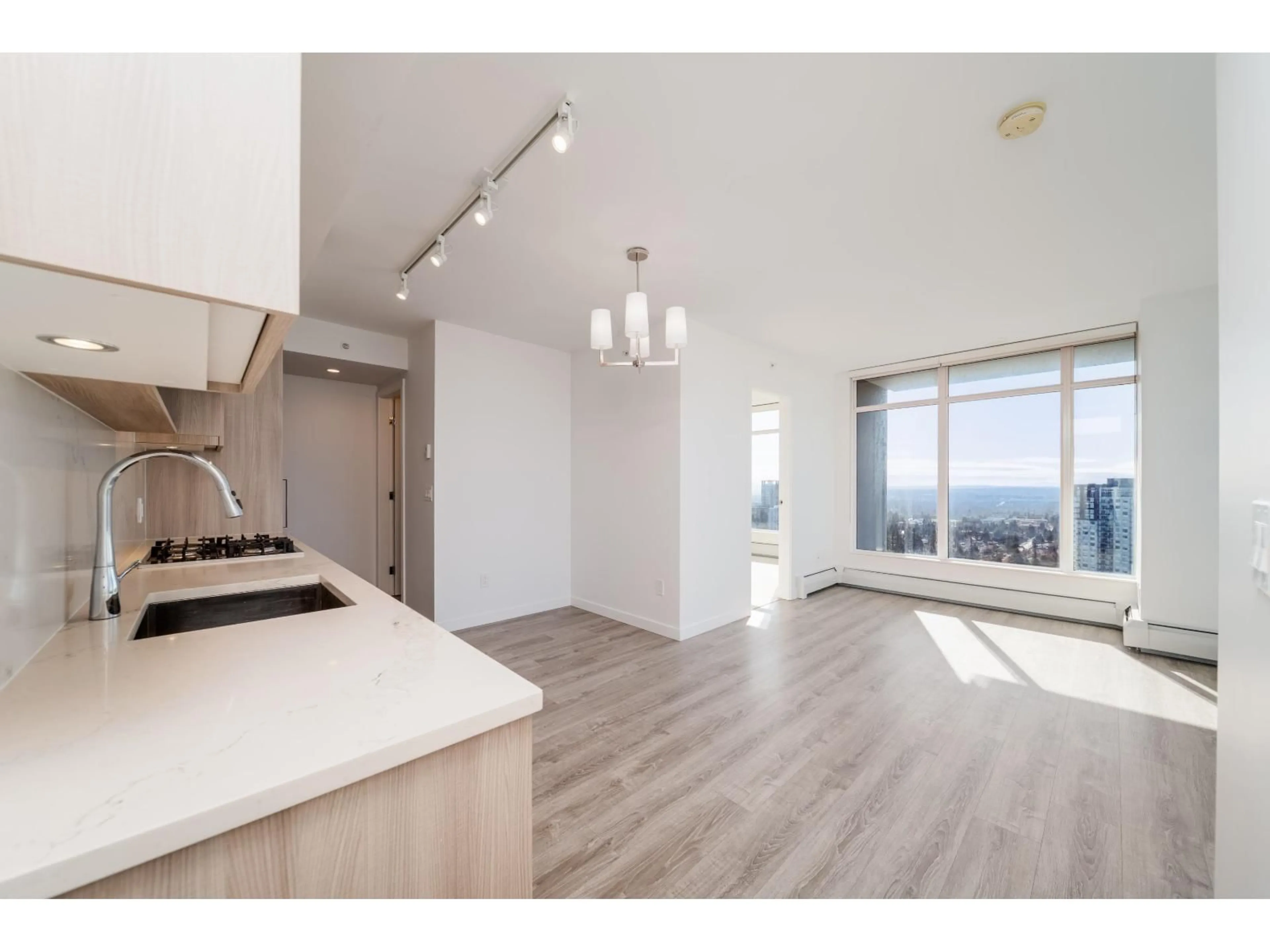 Open concept kitchen, wood/laminate floor for 3511 - 13350 CENTRAL AVENUE, Surrey British Columbia V3T0S1