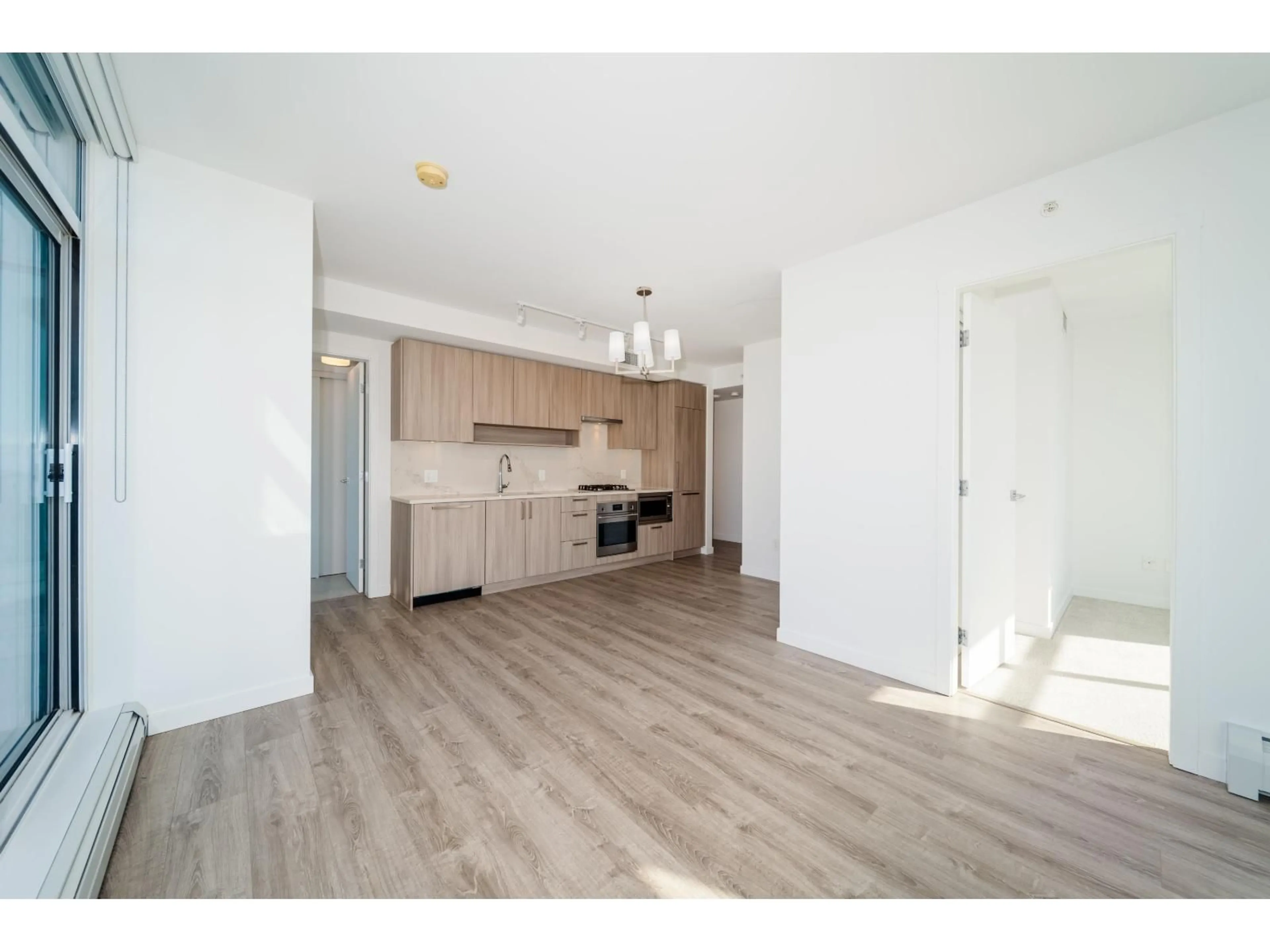 Open concept kitchen, wood/laminate floor for 3511 - 13350 CENTRAL AVENUE, Surrey British Columbia V3T0S1
