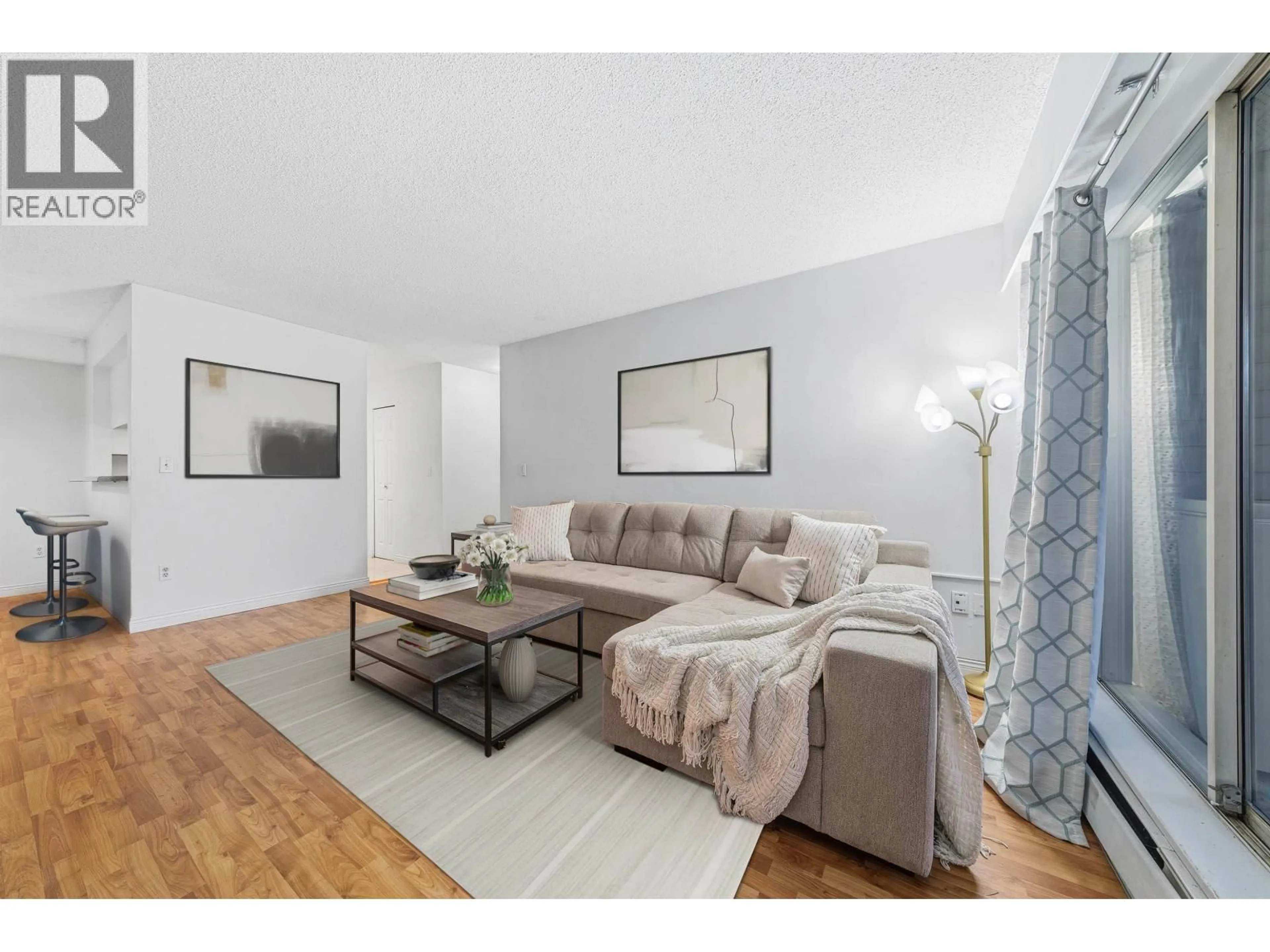 Living room with furniture, wood/laminate floor for 105 - 932 ROBINSON STREET, Coquitlam British Columbia V3J7R8