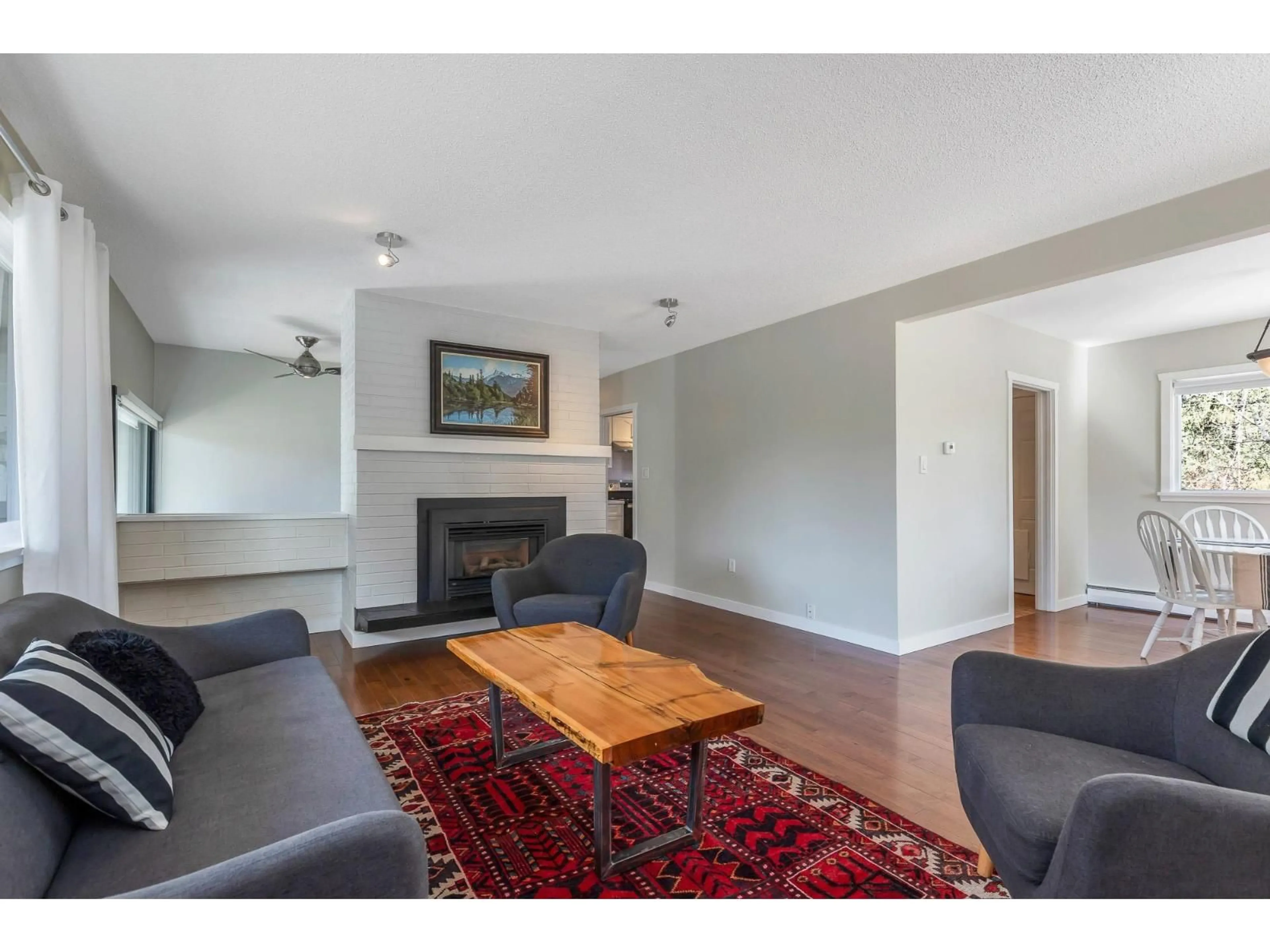 Living room with furniture, wood/laminate floor for 7958 TAULBUT STREET, Mission British Columbia V2V3W7