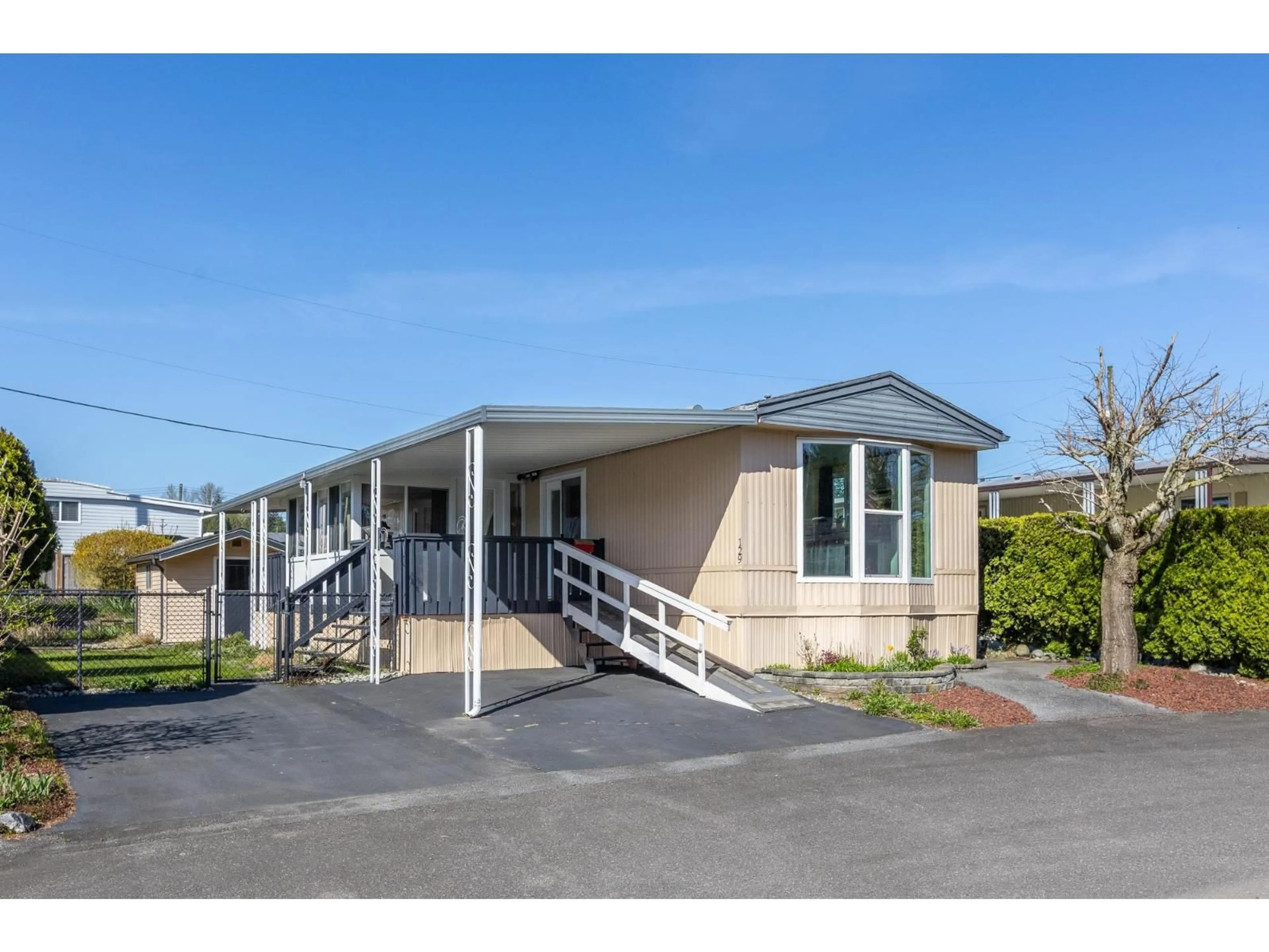 Home with vinyl exterior material, street for 129 - 27111 0 AVENUE, Langley British Columbia V4W2T3