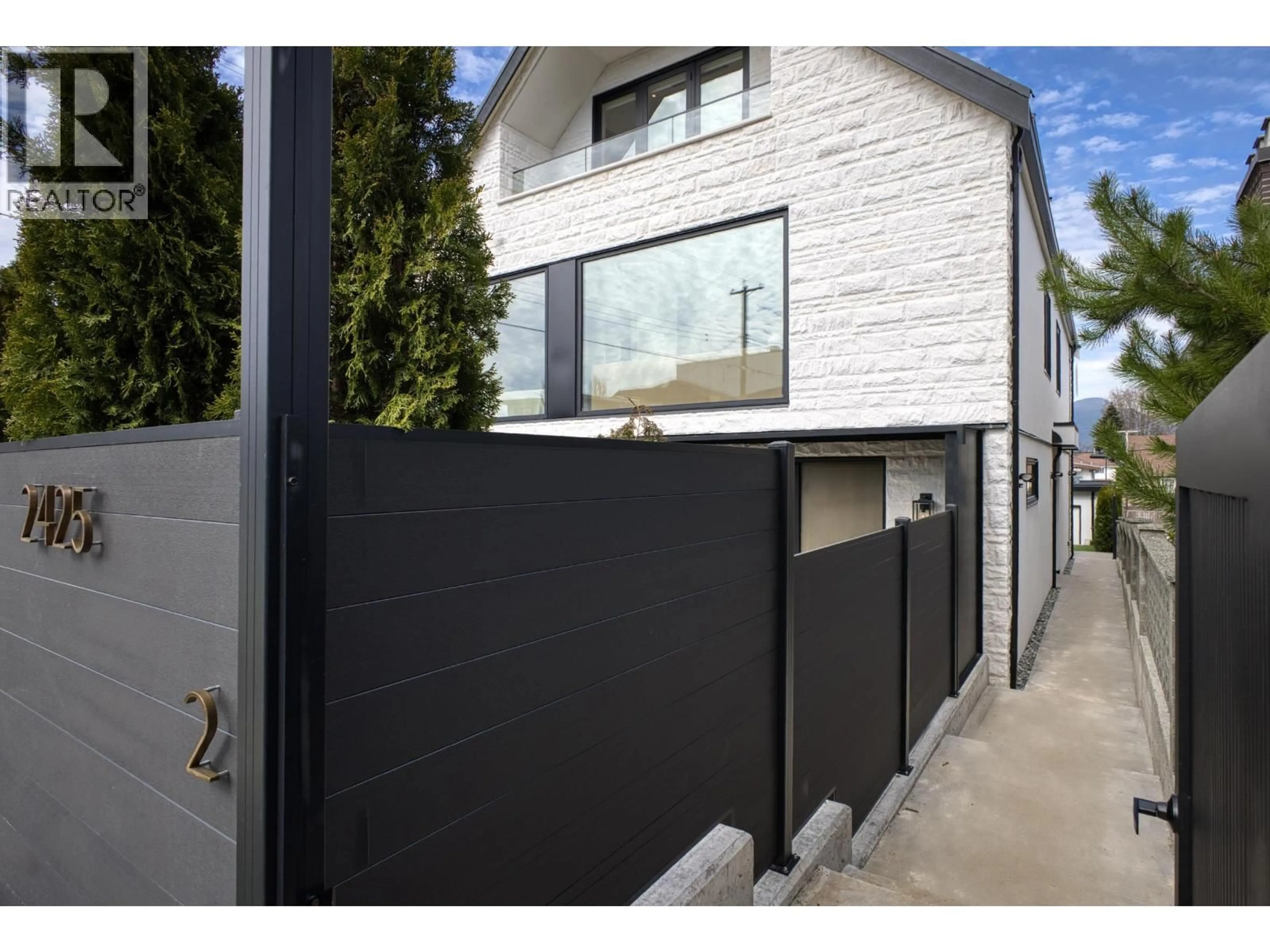 Home with brick exterior material, street for 2 - 2425 KITCHENER STREET, Vancouver British Columbia V5K3C4