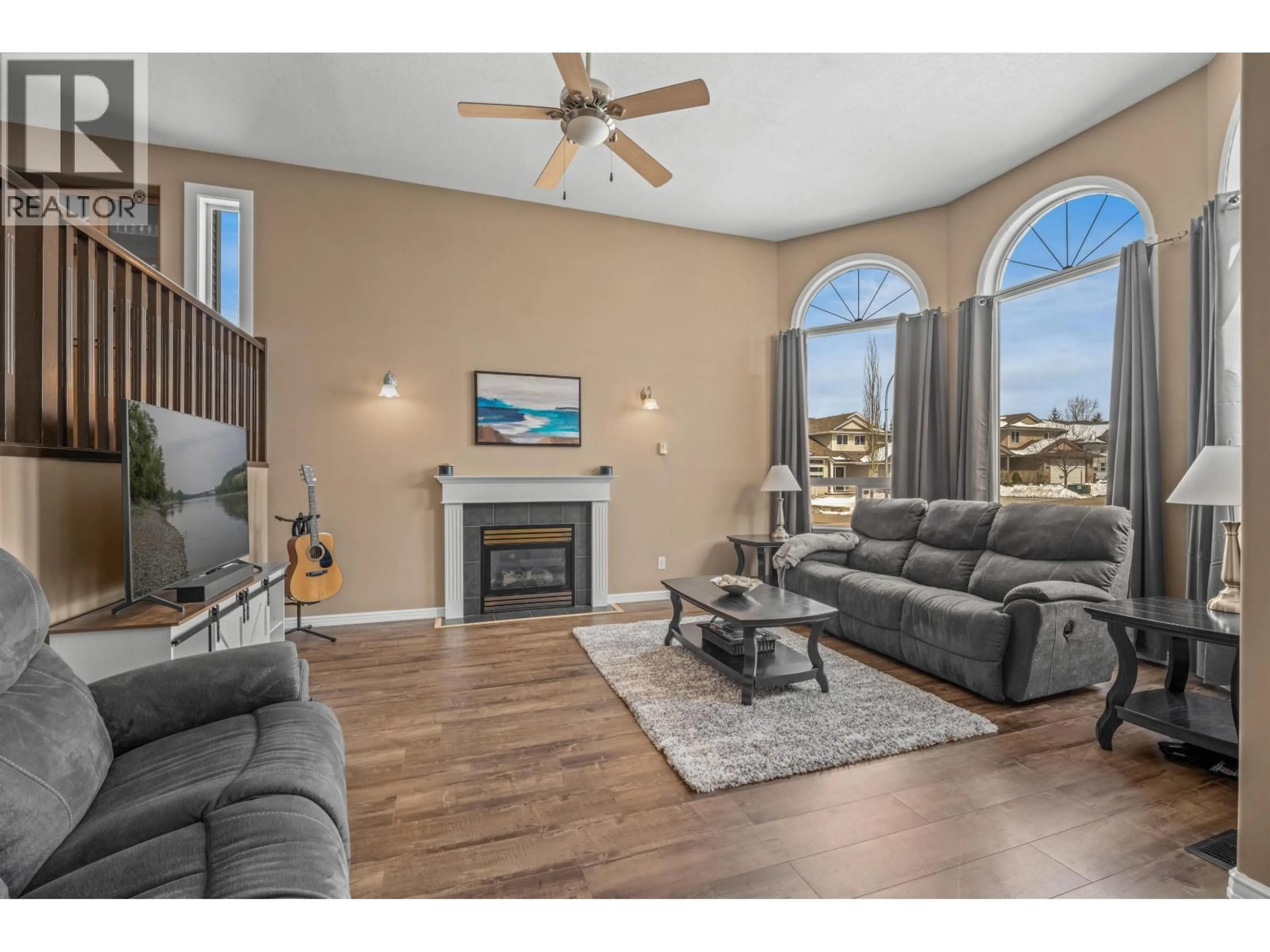 Living room with furniture, wood/laminate floor for 7003 TRYGG COURT, Prince George British Columbia V2N6Z8