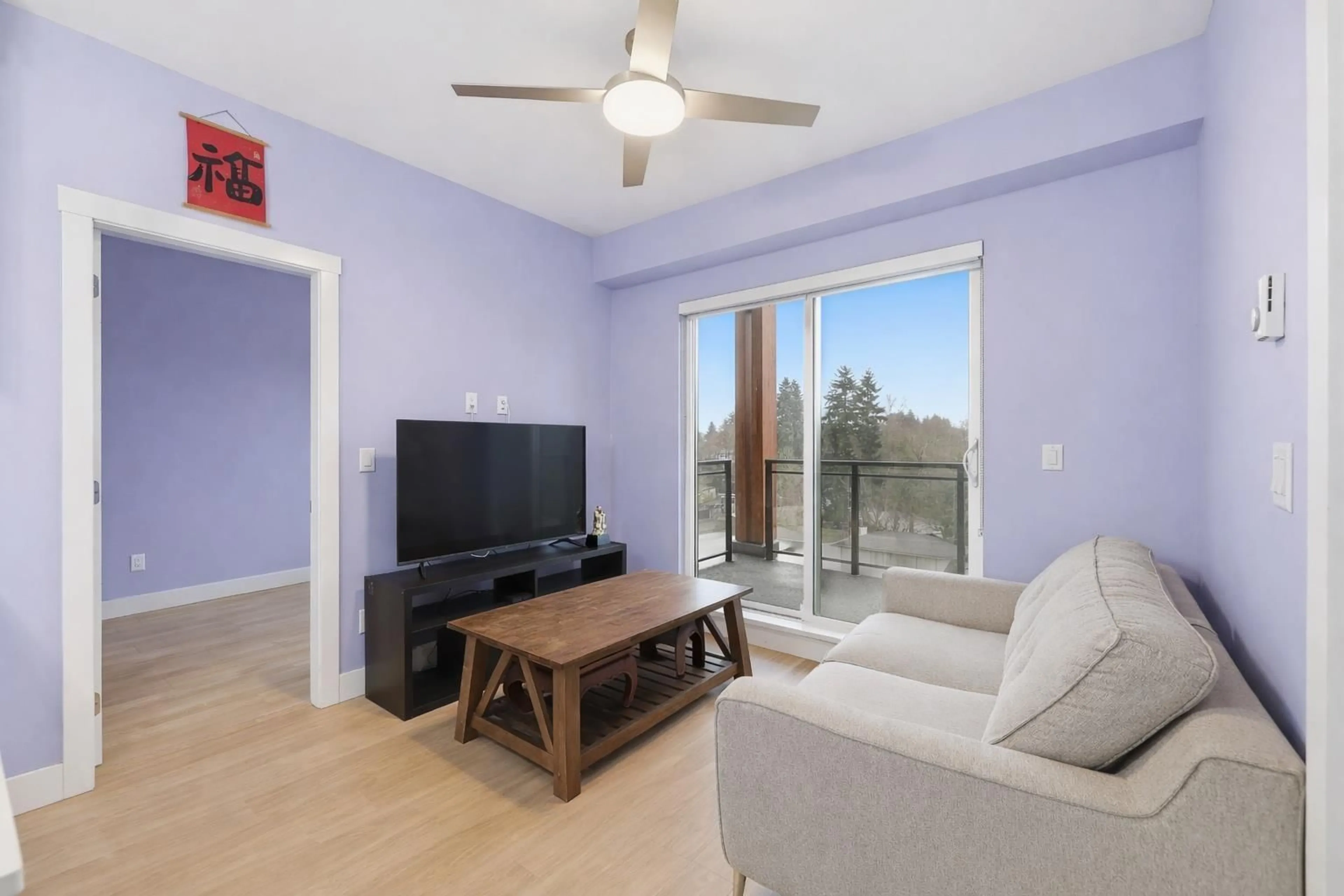 Living room with furniture, wood/laminate floor for 501 - 6950 NICHOLSON ROAD, Delta British Columbia V4E0A8