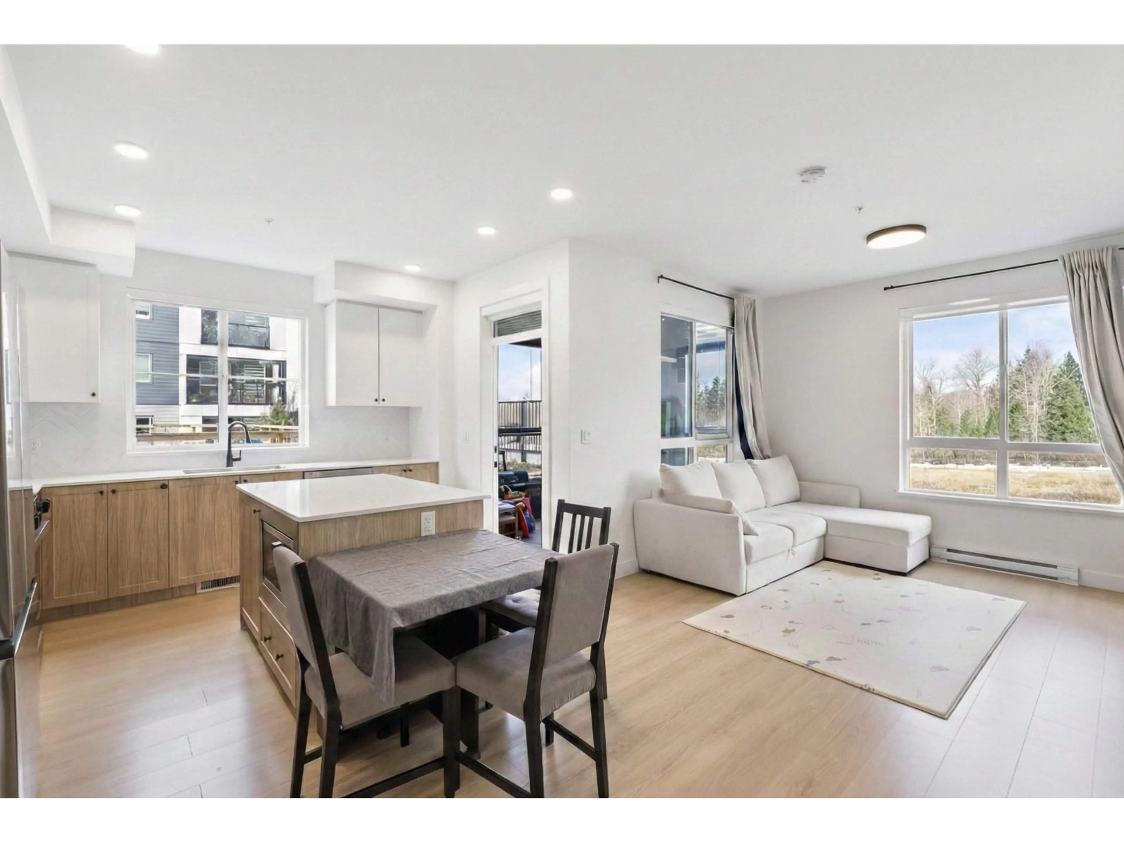 Open concept kitchen, wood/laminate floor for 104 - 19953 76 AVENUE, Langley British Columbia V2Y3Y1