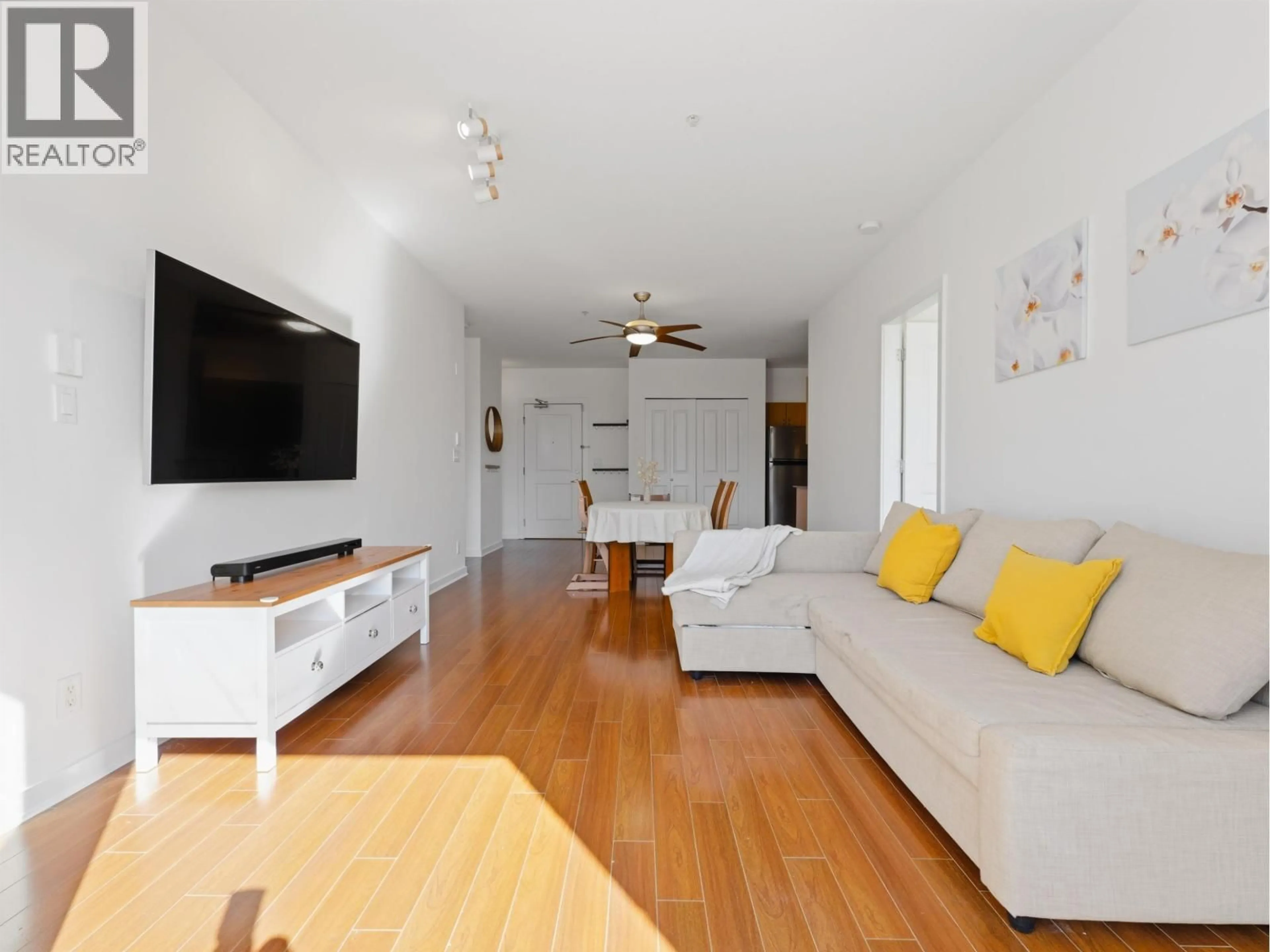 Living room with furniture, wood/laminate floor for 302 - 4479 10TH AVENUE, Vancouver British Columbia V6R2H8