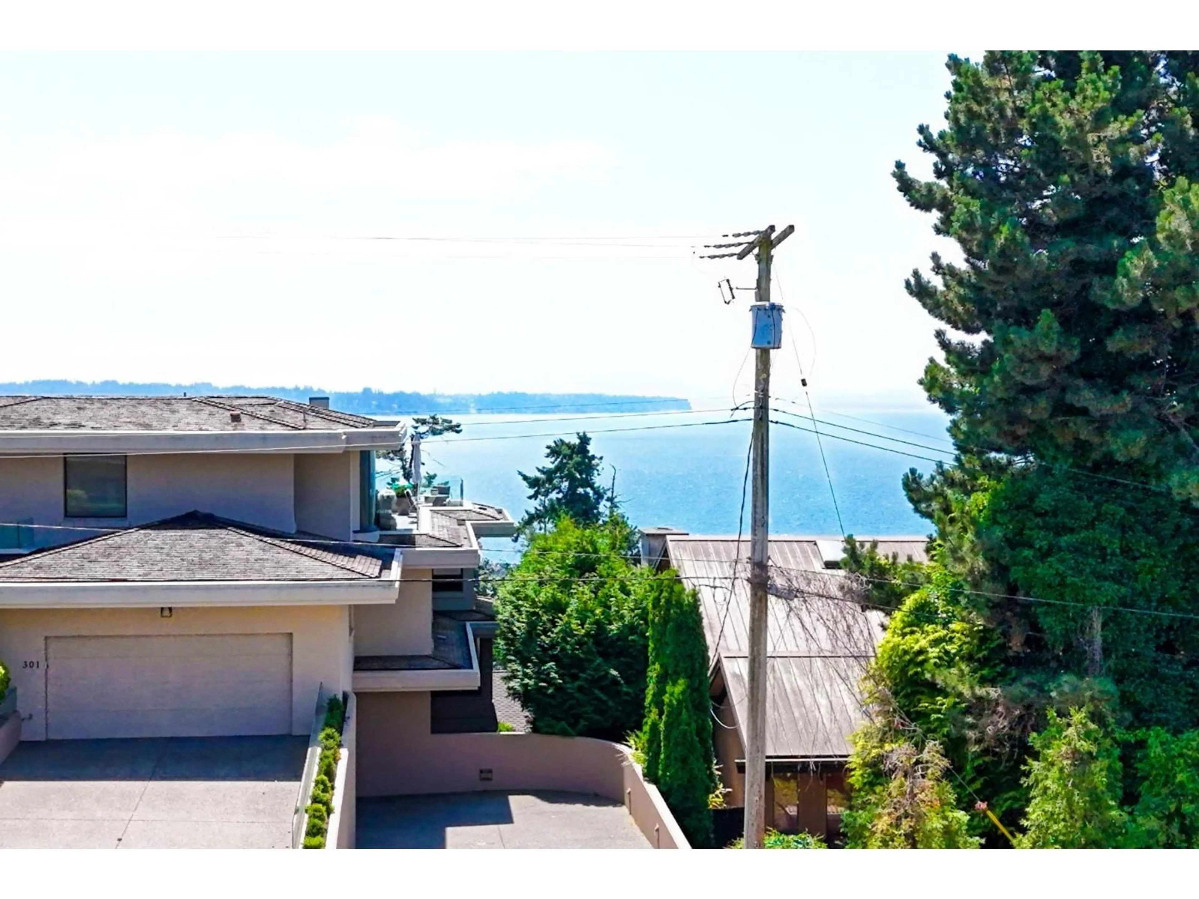 A pic from outside/outdoor area/front of a property/back of a property/a pic from drone, water/lake/river/ocean view for 105 - 15041 PROSPECT AVENUE, White Rock British Columbia V4B2B5
