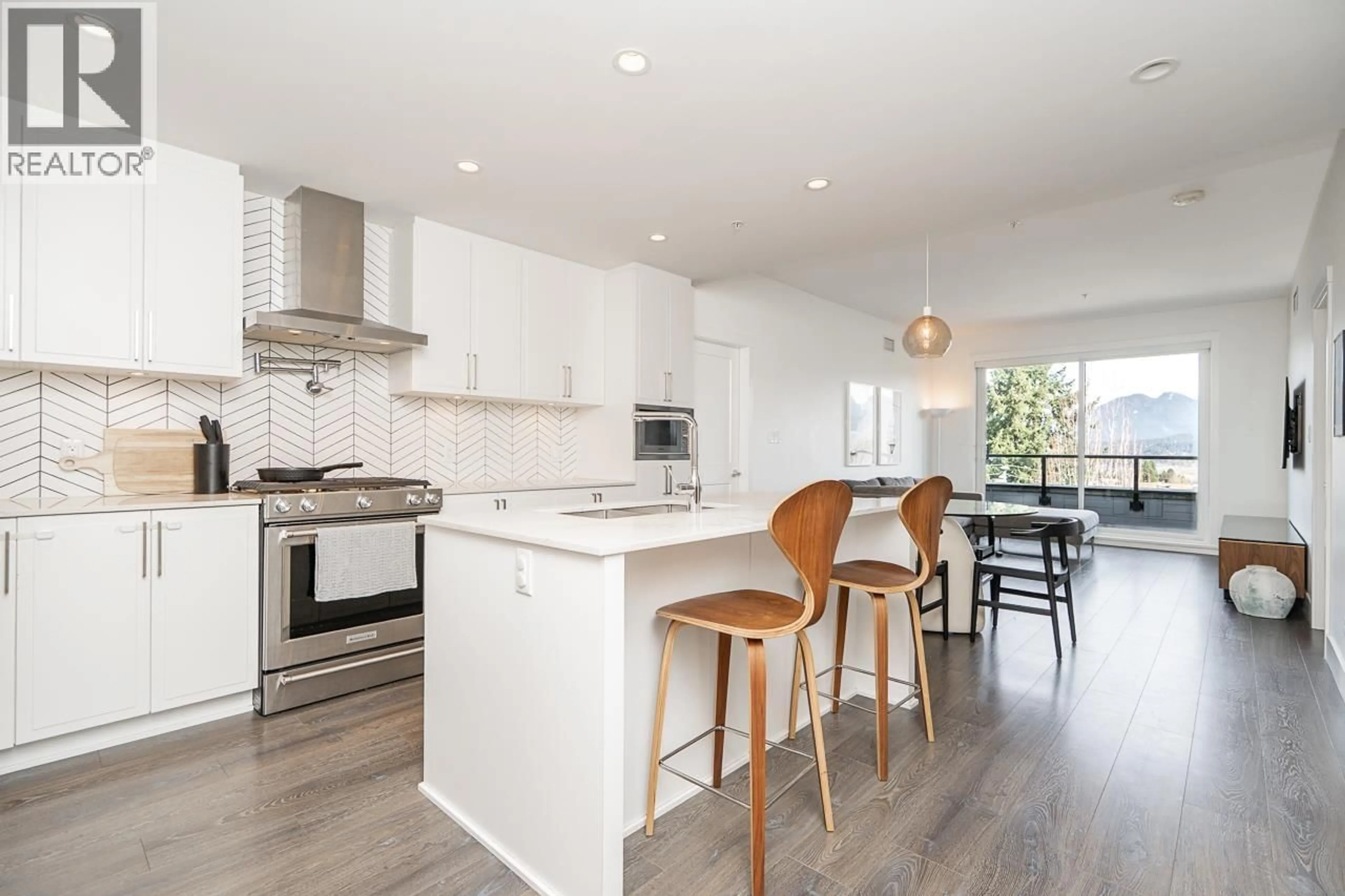 Open concept kitchen, wood/laminate floor for 502 - 4477 HASTINGS STREET, Burnaby British Columbia V5C2K1