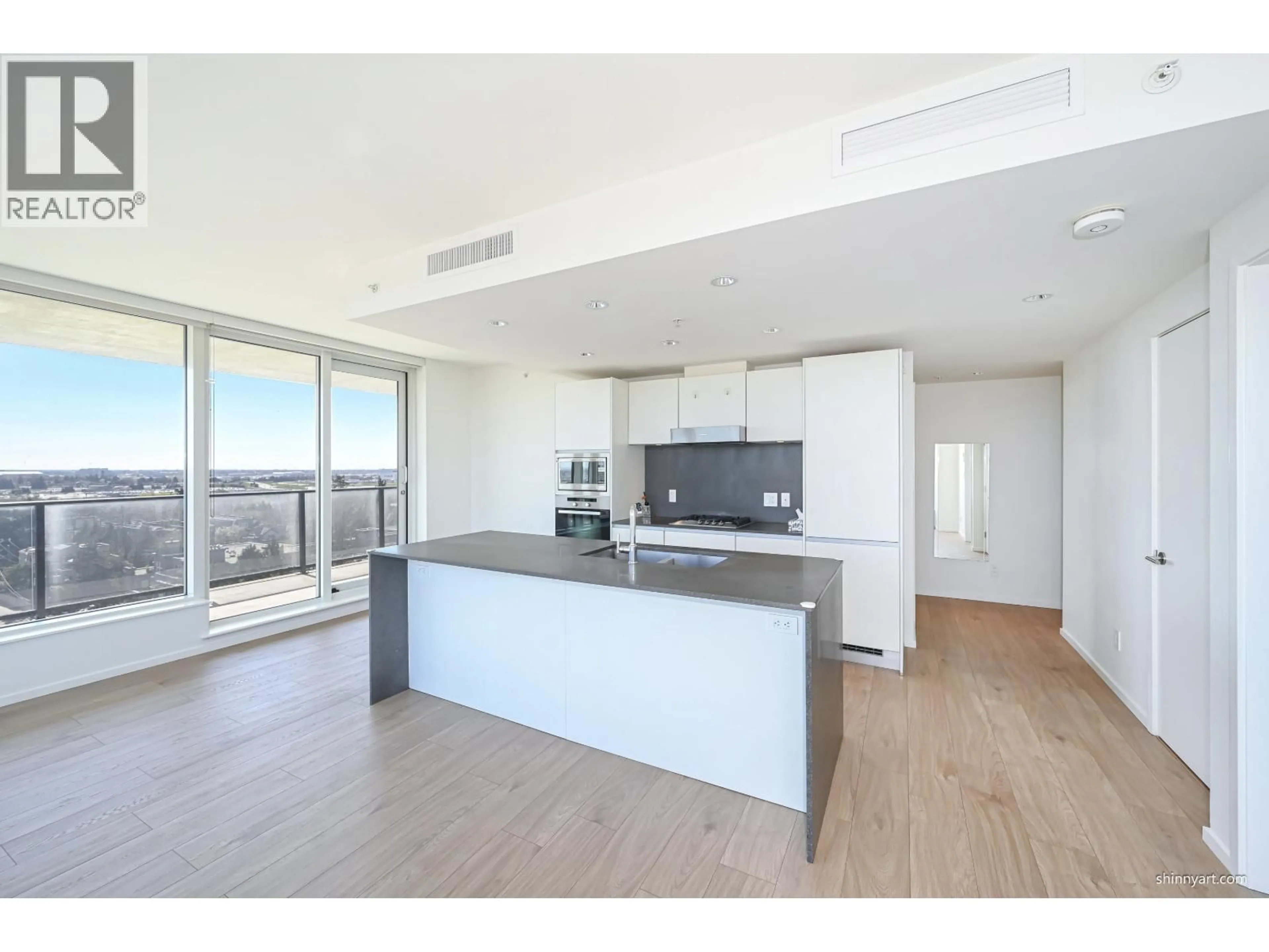 Open concept kitchen, wood/laminate floor for 808 - 8555 GRANVILLE STREET, Vancouver British Columbia V6P0C3