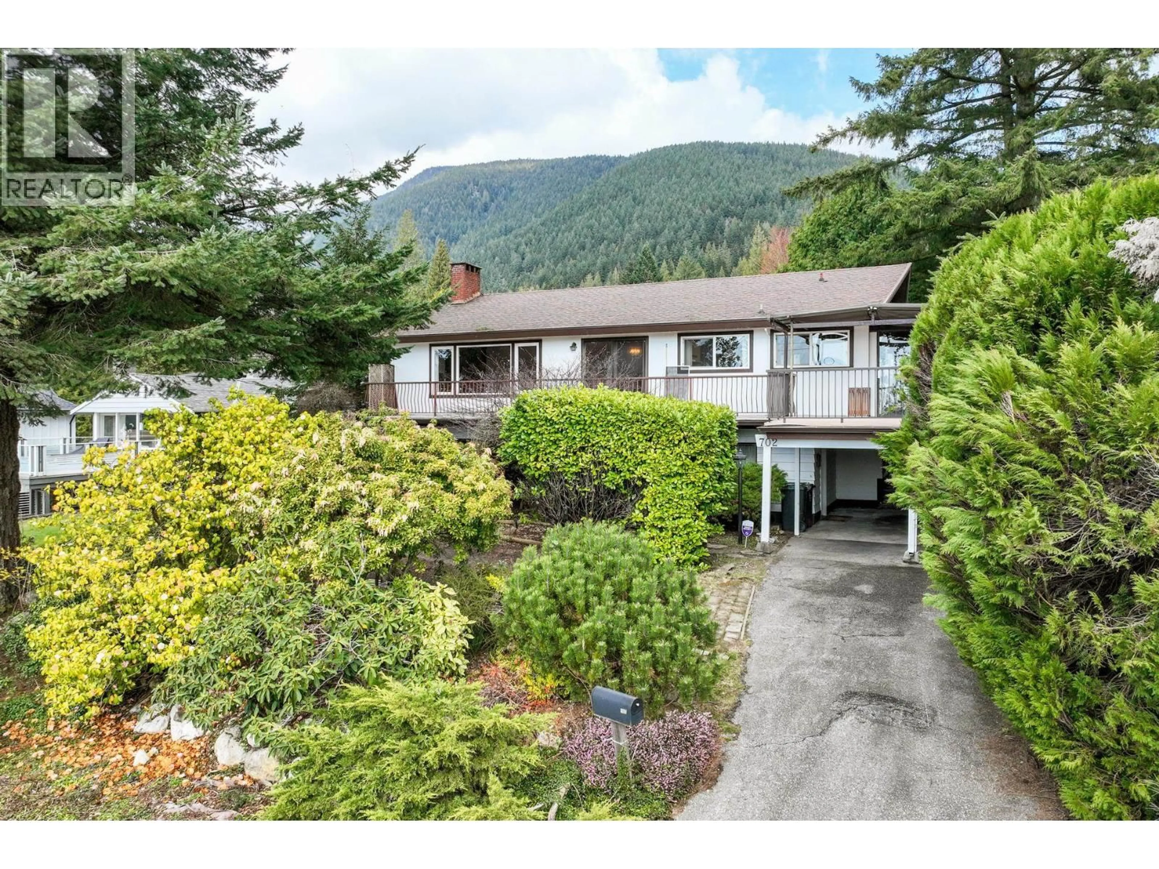 A pic from outside/outdoor area/front of a property/back of a property/a pic from drone, mountain view for 702 WINONA AVENUE, North Vancouver British Columbia V7R2B1