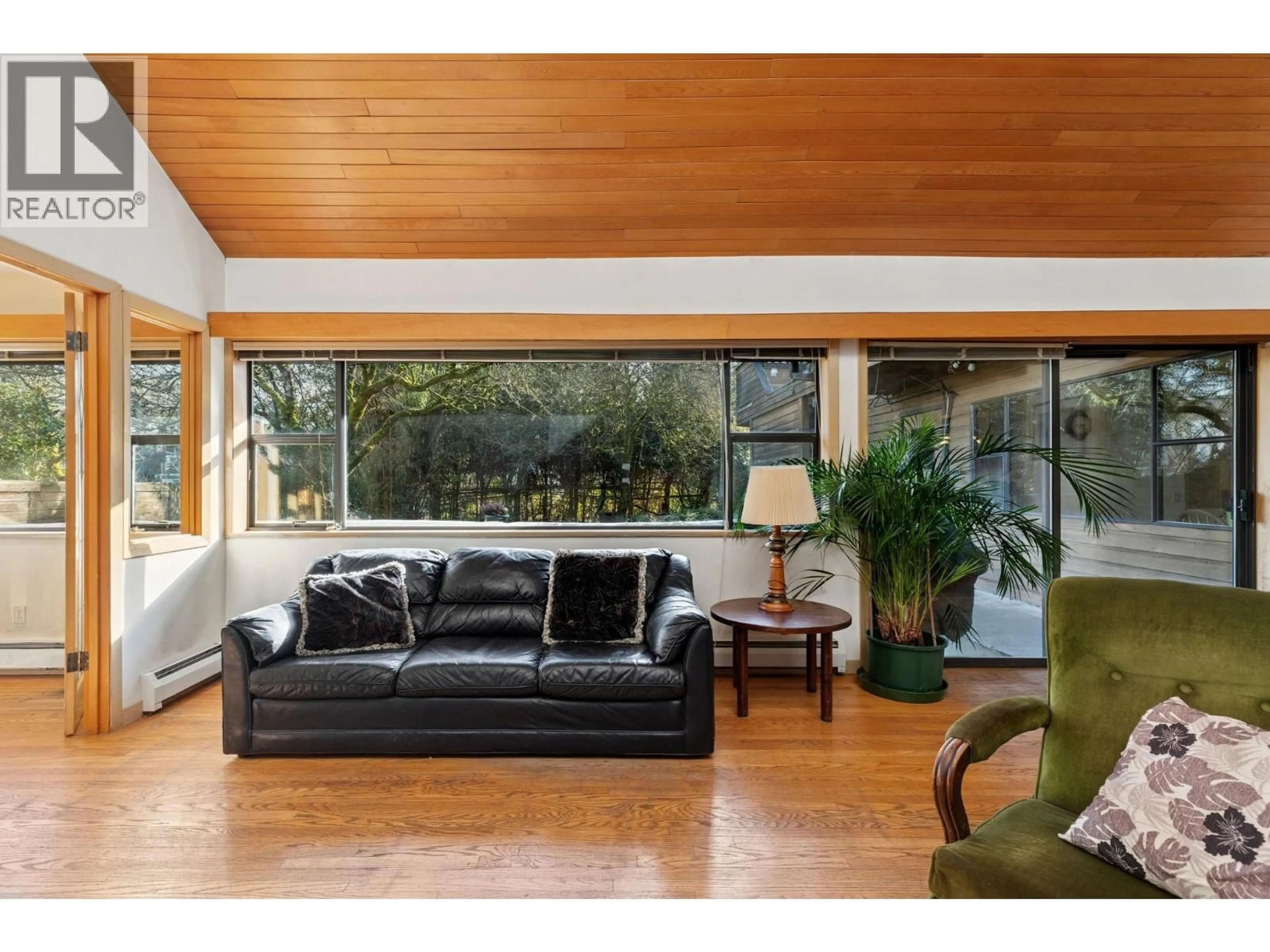 Living room with furniture, wood/laminate floor for 4436 11TH AVENUE, Vancouver British Columbia V6R2M3