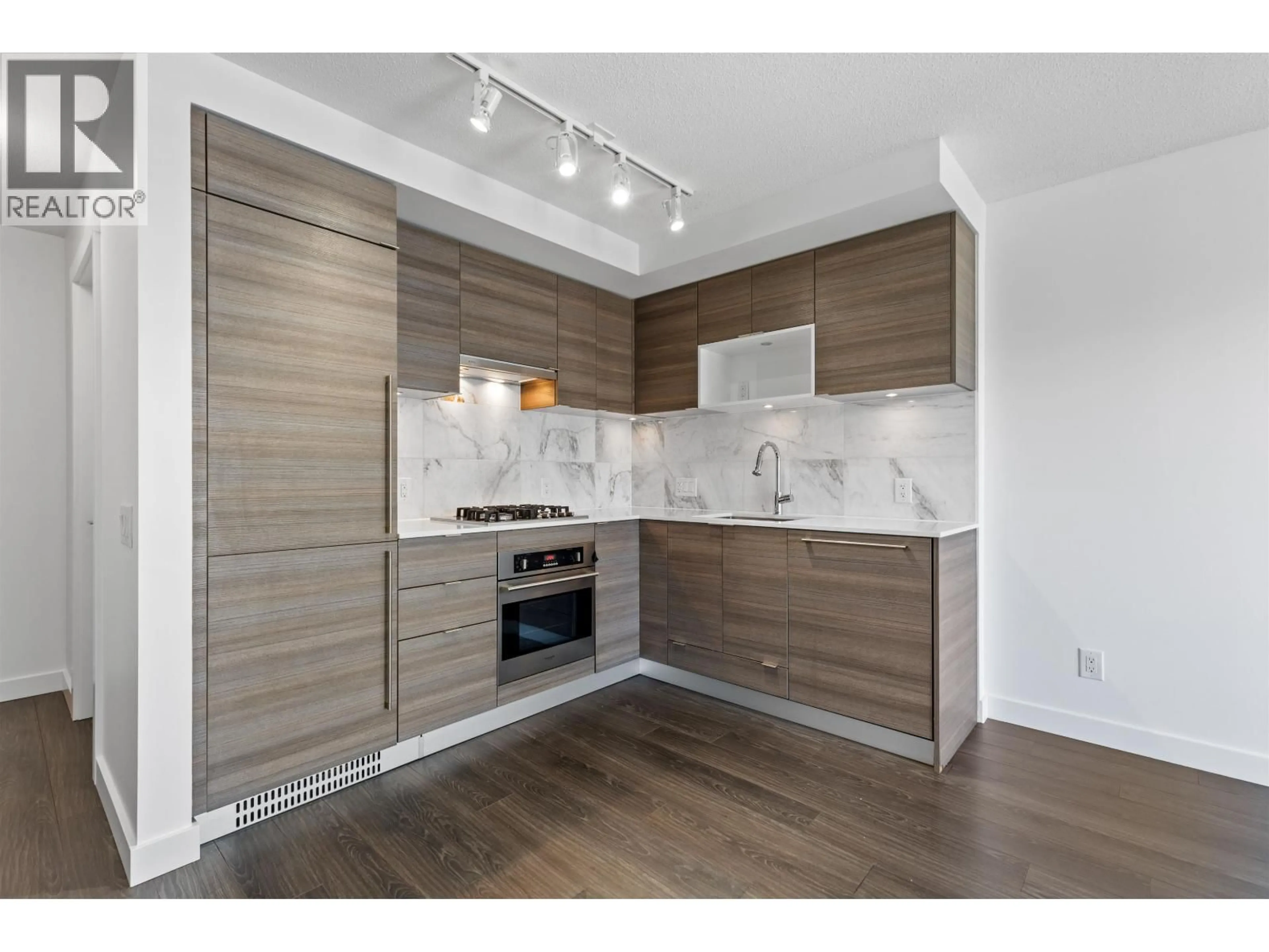 Open concept kitchen, wood/laminate floor for 2501 - 602 COMO LAKE AVENUE, Coquitlam British Columbia V3J0G2