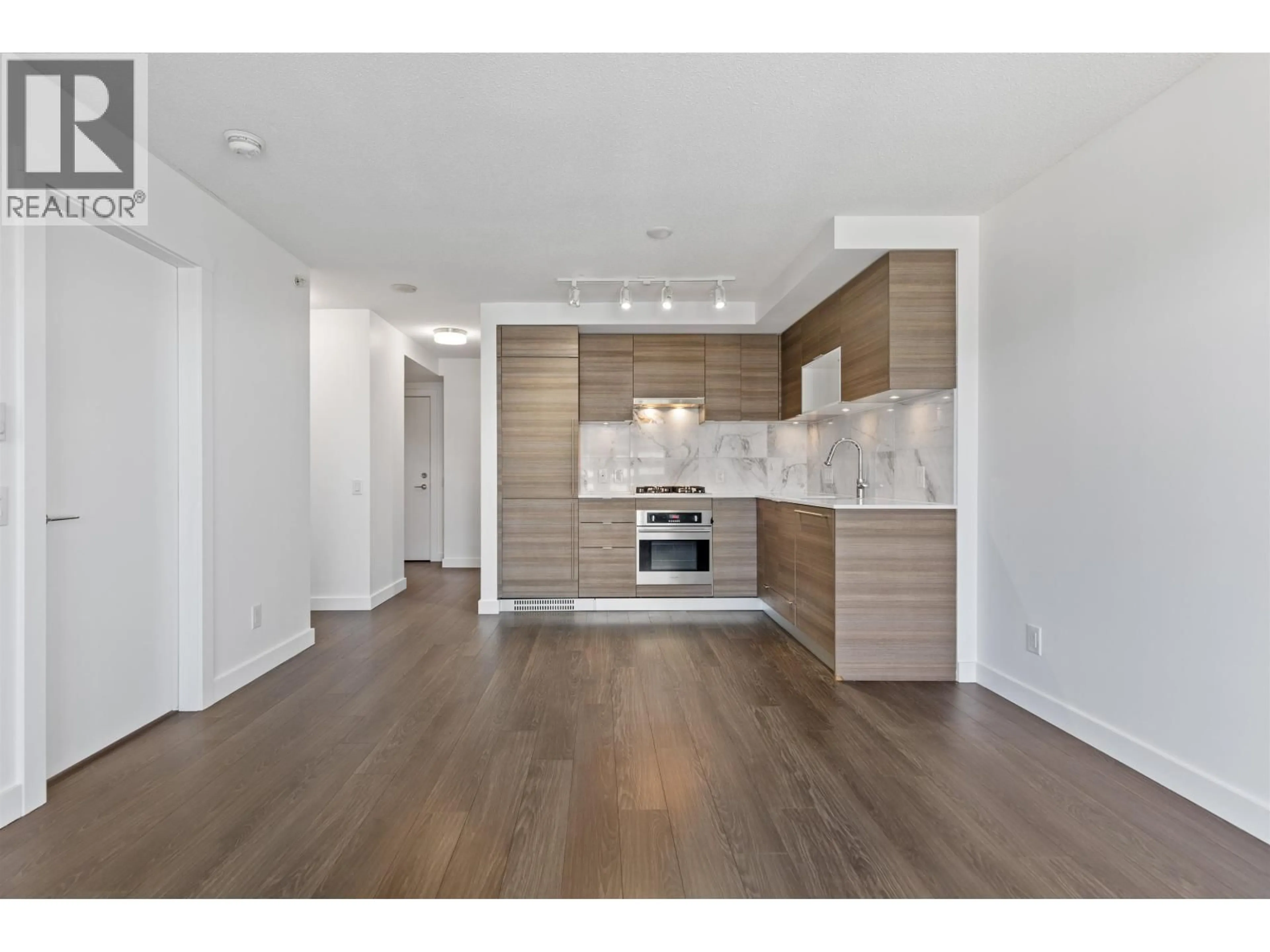 Open concept kitchen, wood/laminate floor for 2501 - 602 COMO LAKE AVENUE, Coquitlam British Columbia V3J0G2