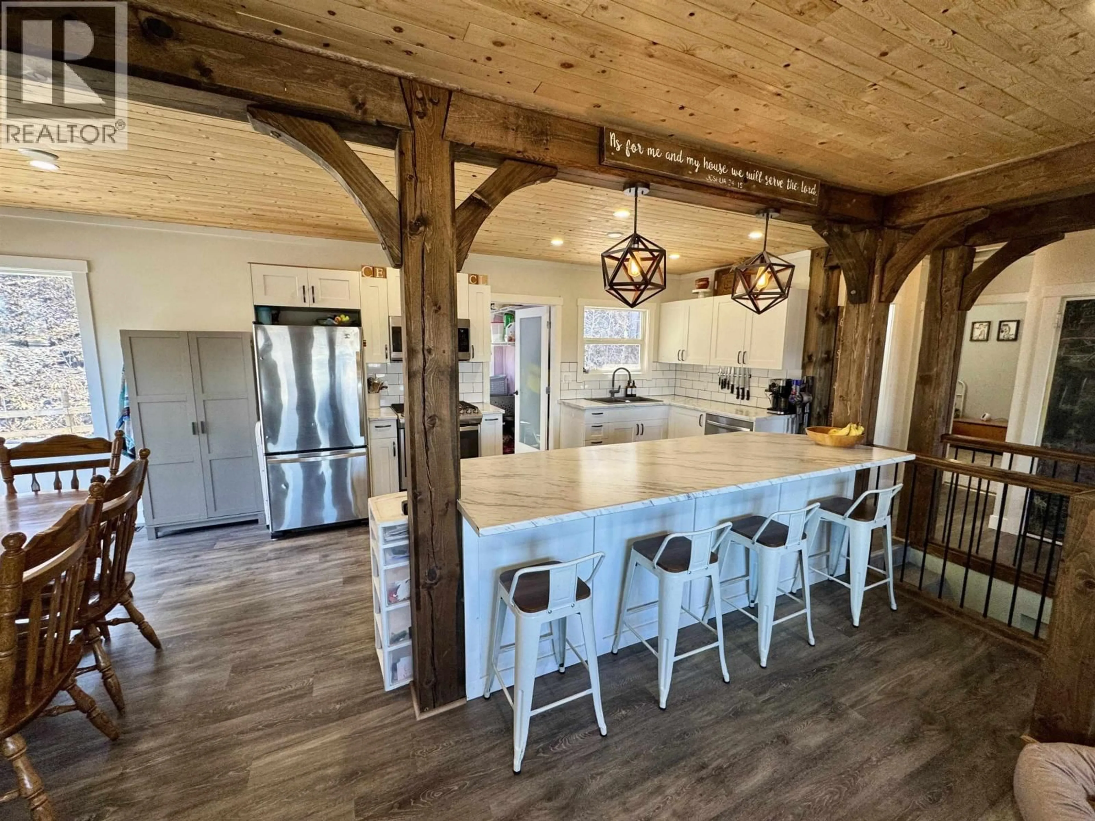 Open concept kitchen, wood/laminate floor for 1681 1ST STREET, Telkwa British Columbia V0J2X0