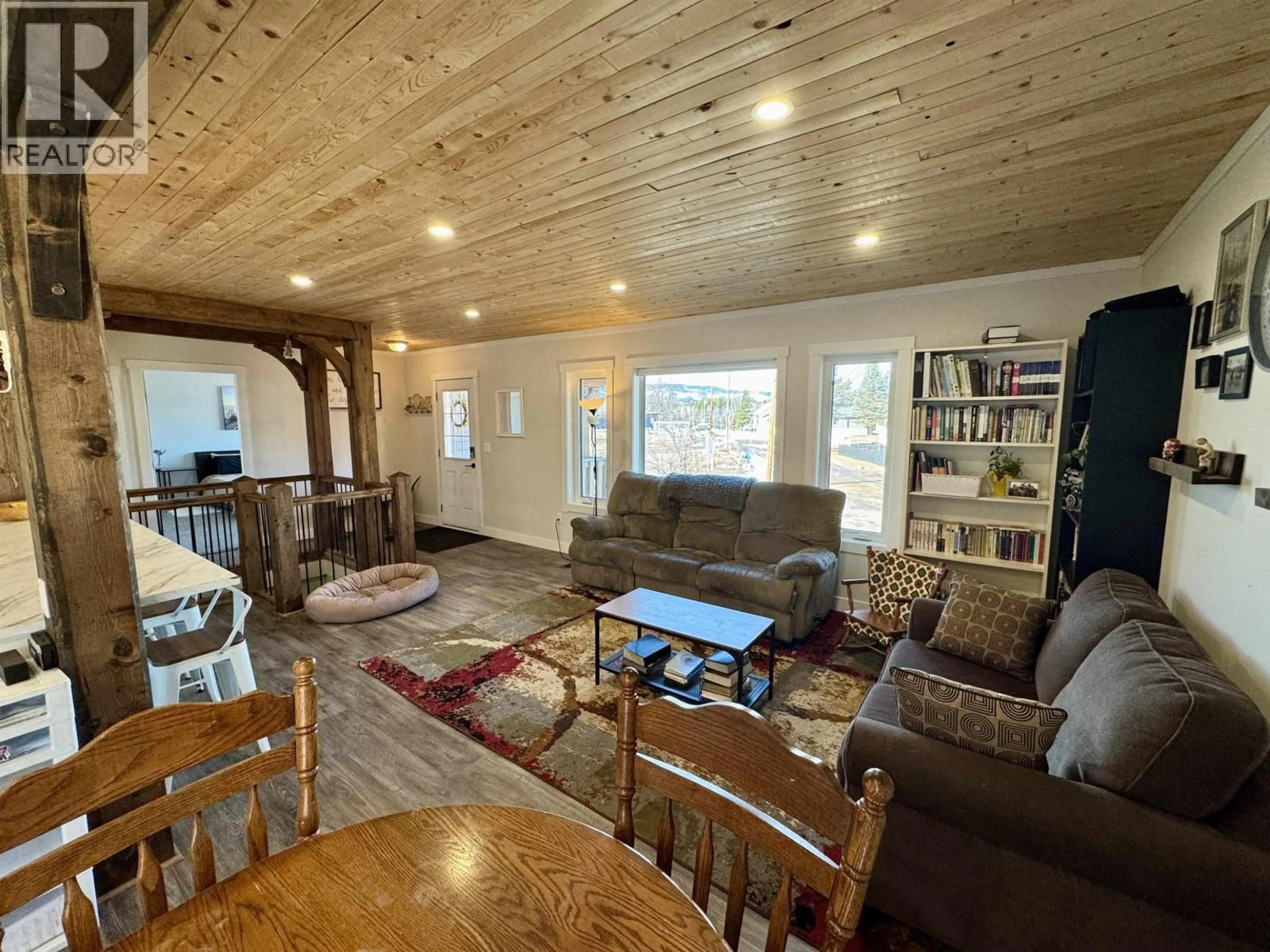 Living room with furniture, wood/laminate floor for 1681 1ST STREET, Telkwa British Columbia V0J2X0