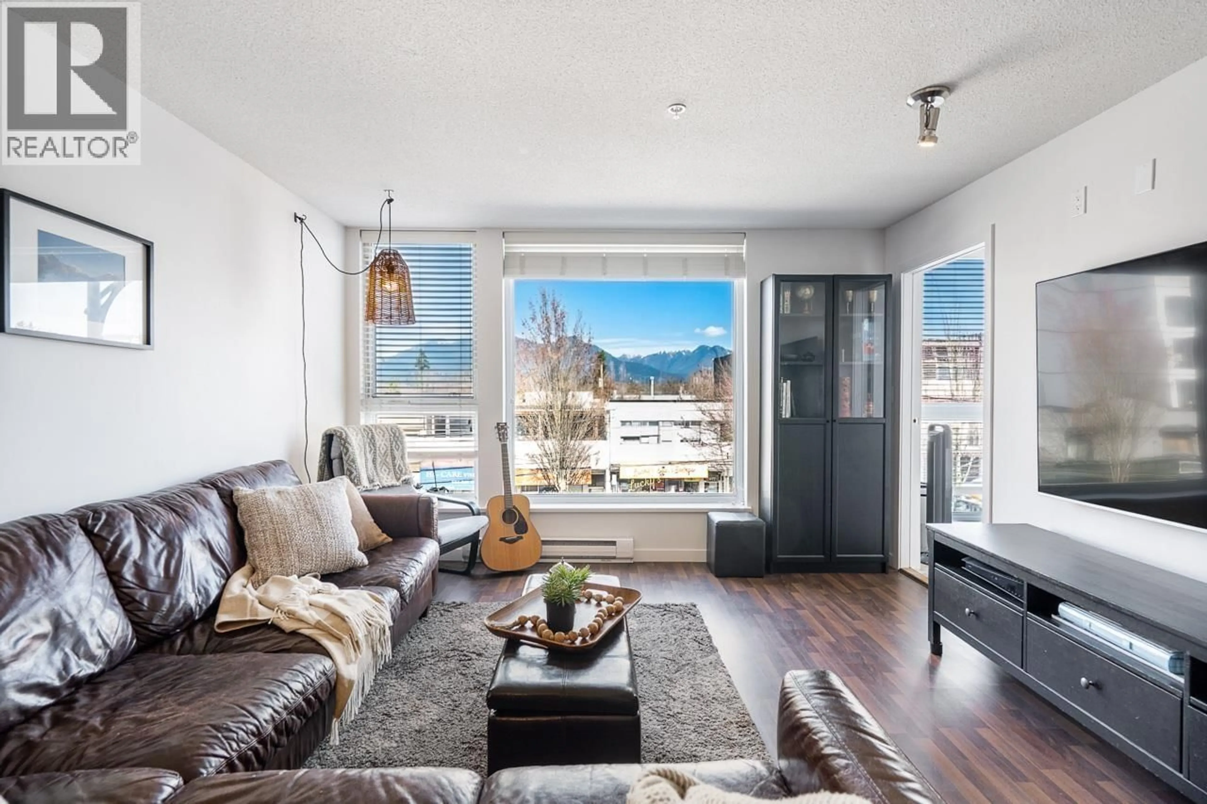 Living room with furniture, wood/laminate floor for 310 - 2636 HASTINGS STREET, Vancouver British Columbia V5K0A4