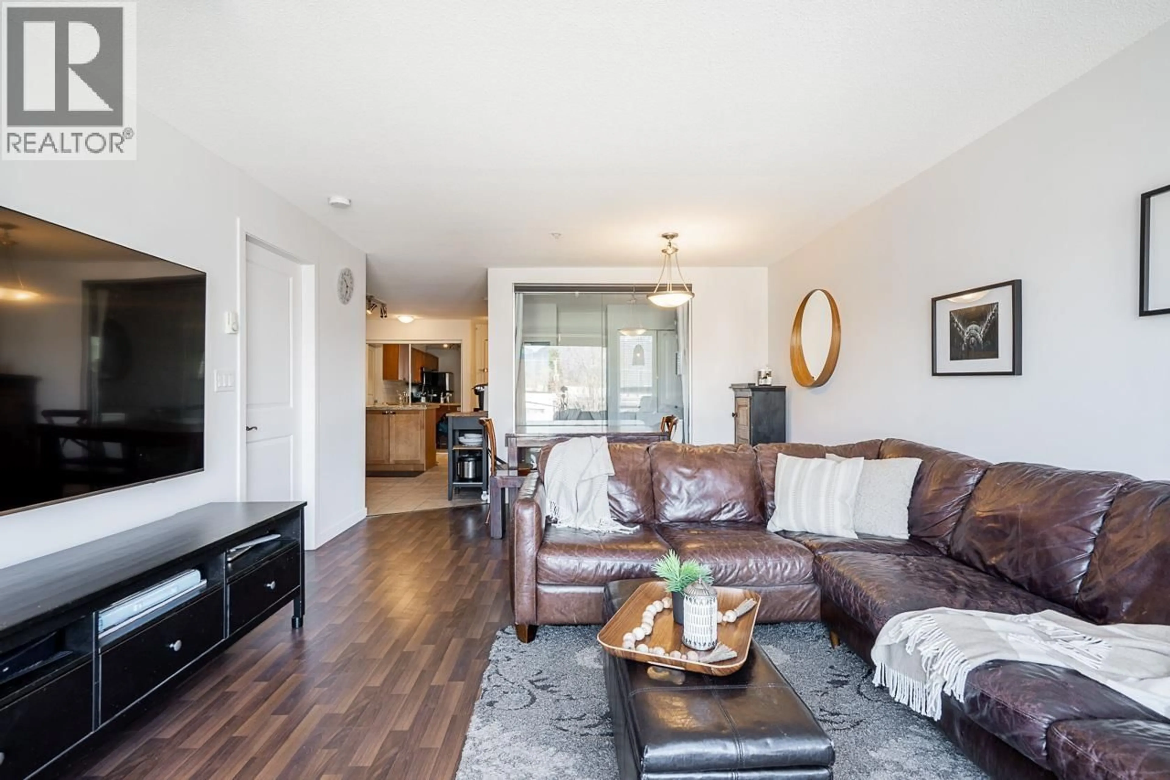 Living room with furniture, wood/laminate floor for 310 - 2636 HASTINGS STREET, Vancouver British Columbia V5K0A4