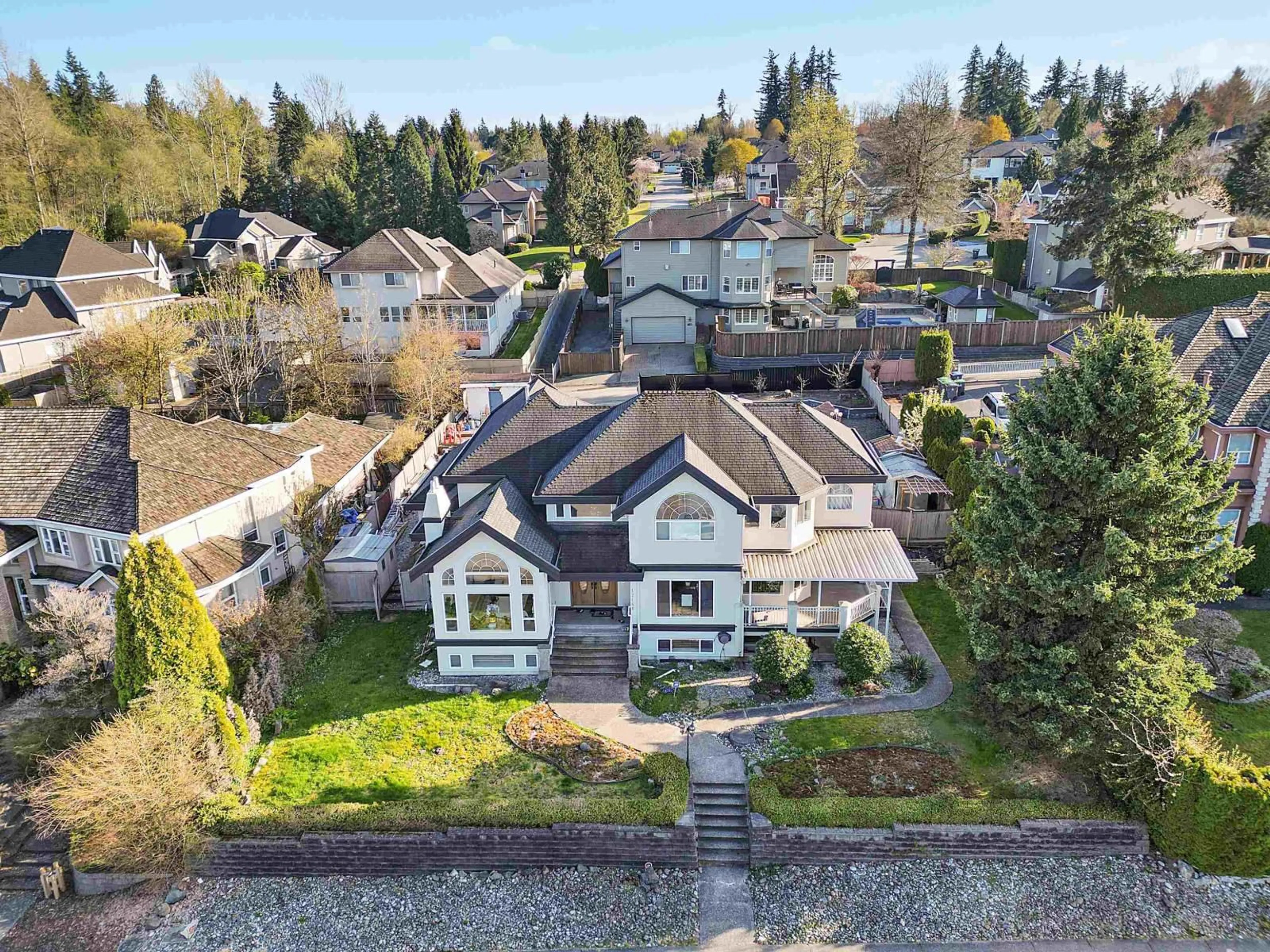 A pic from outside/outdoor area/front of a property/back of a property/a pic from drone, street for 17148 104 AVENUE, Surrey British Columbia V4N4R6