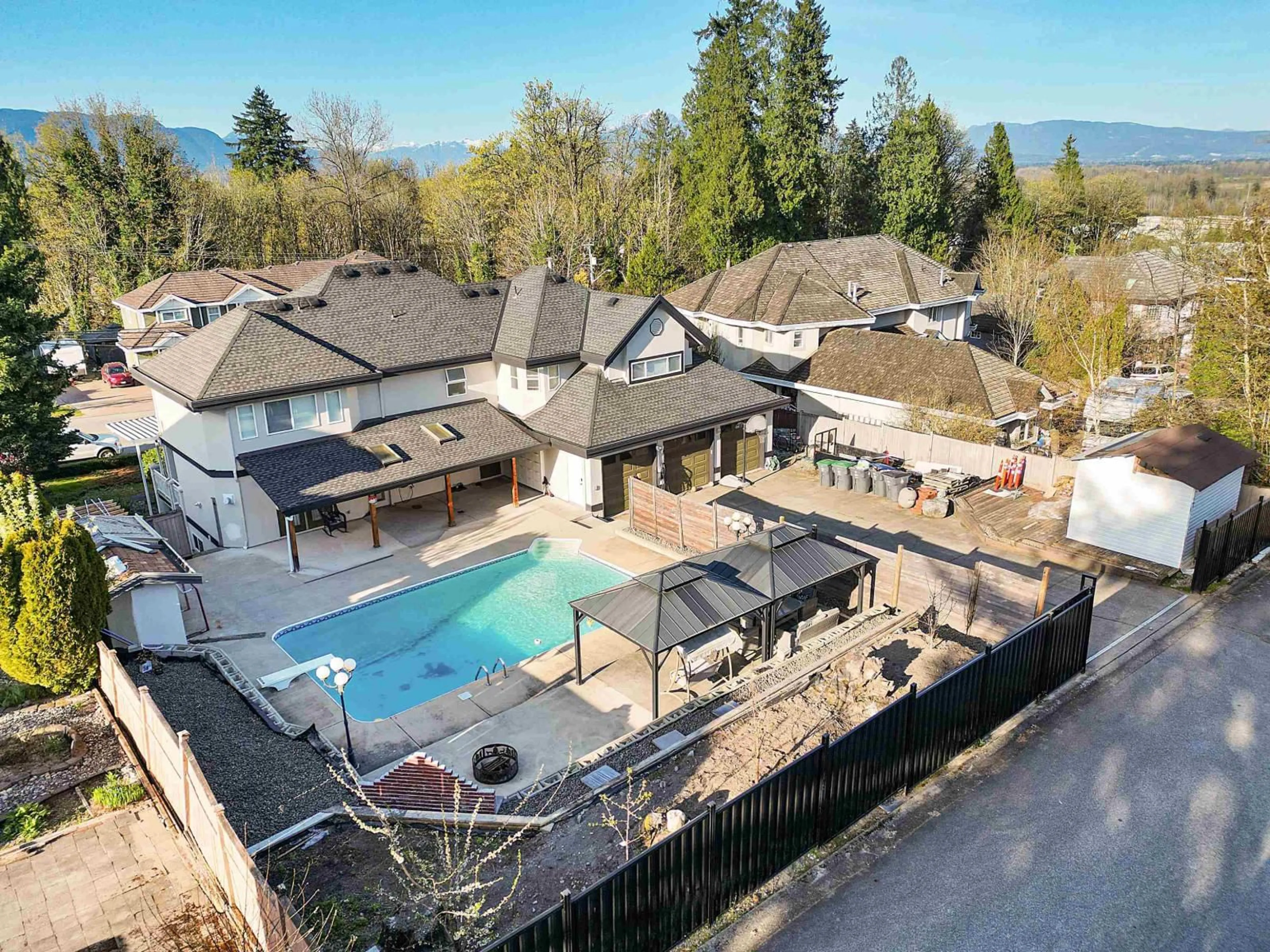 A pic from outside/outdoor area/front of a property/back of a property/a pic from drone, mountain view for 17148 104 AVENUE, Surrey British Columbia V4N4R6
