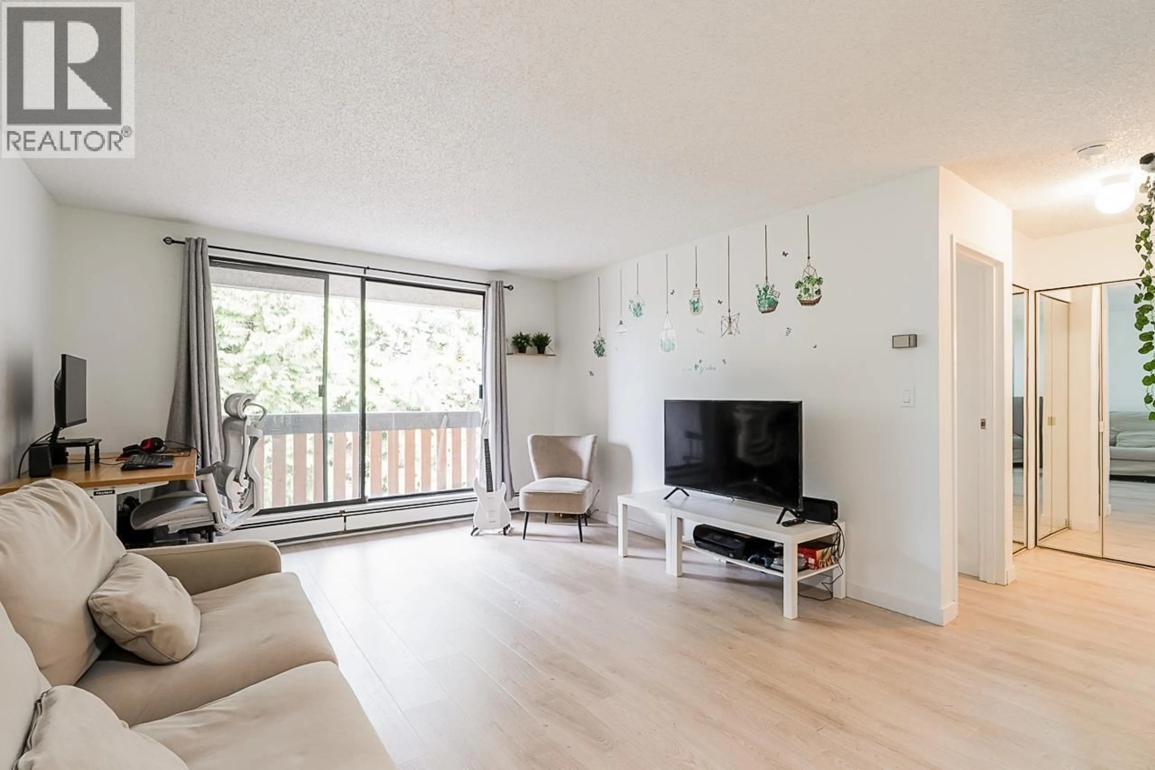 Living room with furniture, wood/laminate floor for 210 - 8640 CITATION DRIVE, Richmond British Columbia V6Y3A3