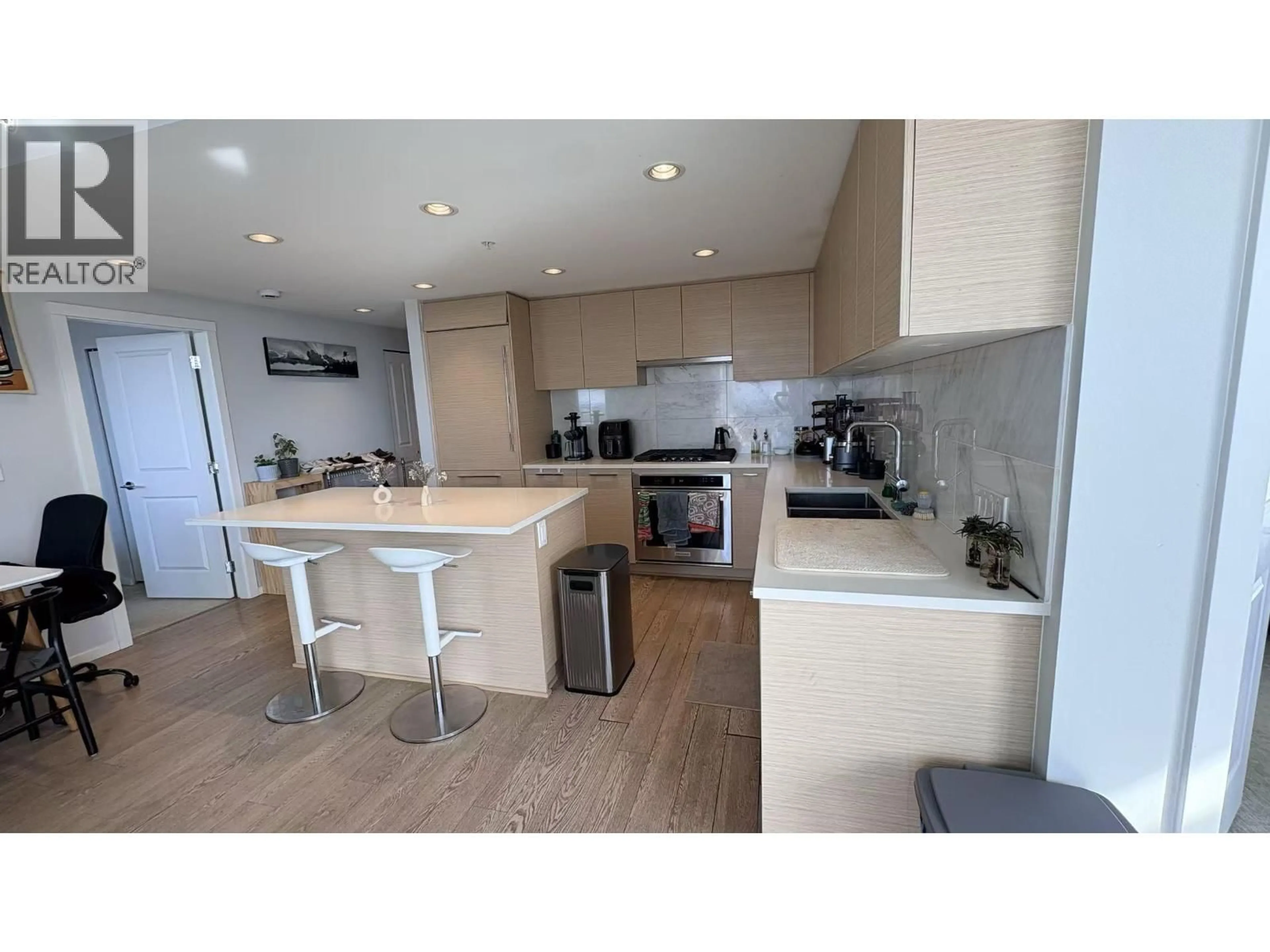 Open concept kitchen, wood/laminate floor for 2308 - 6700 DUNBLANE AVENUE, Burnaby British Columbia V5H0J3