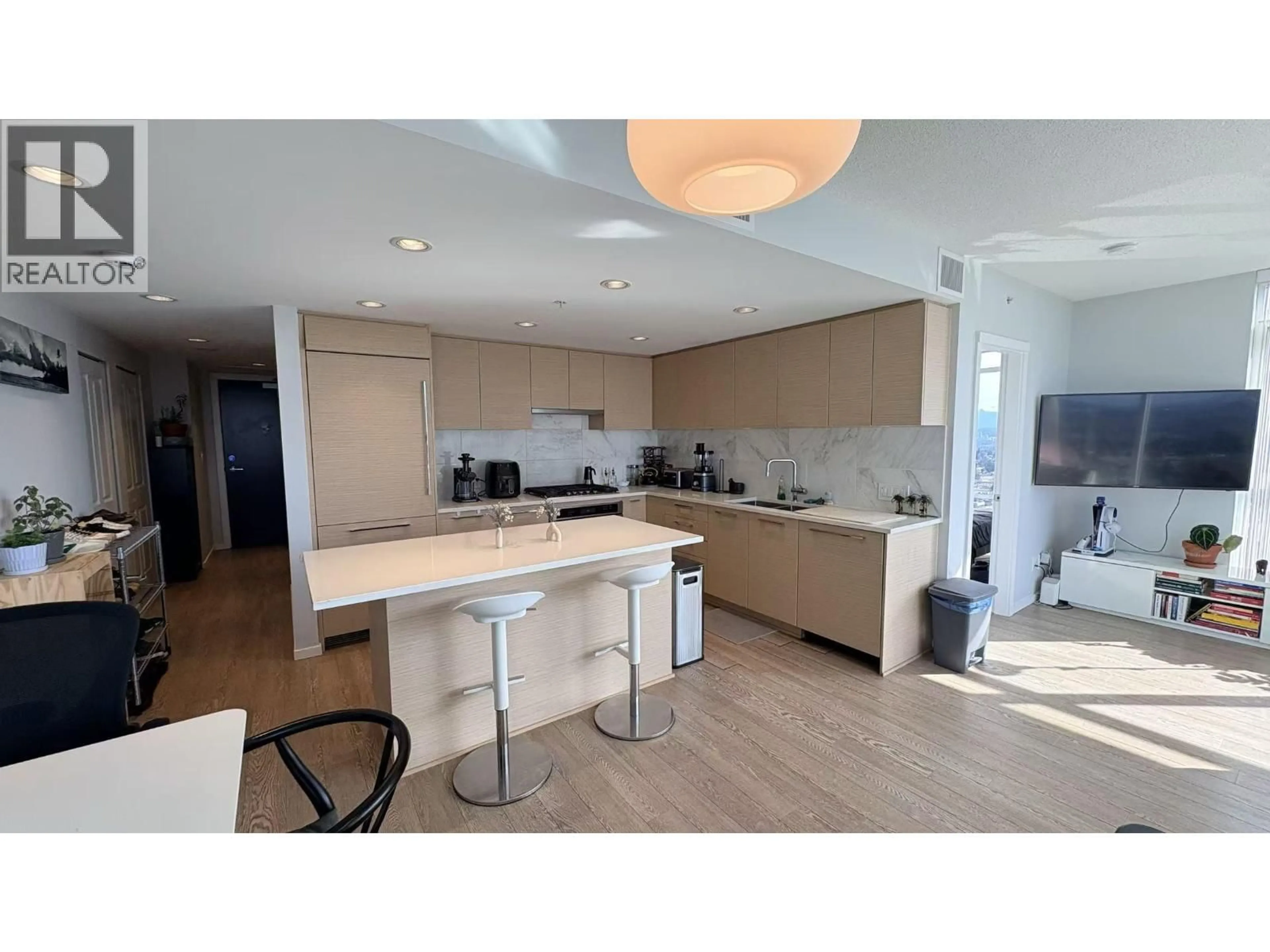 Open concept kitchen, wood/laminate floor for 2308 - 6700 DUNBLANE AVENUE, Burnaby British Columbia V5H0J3