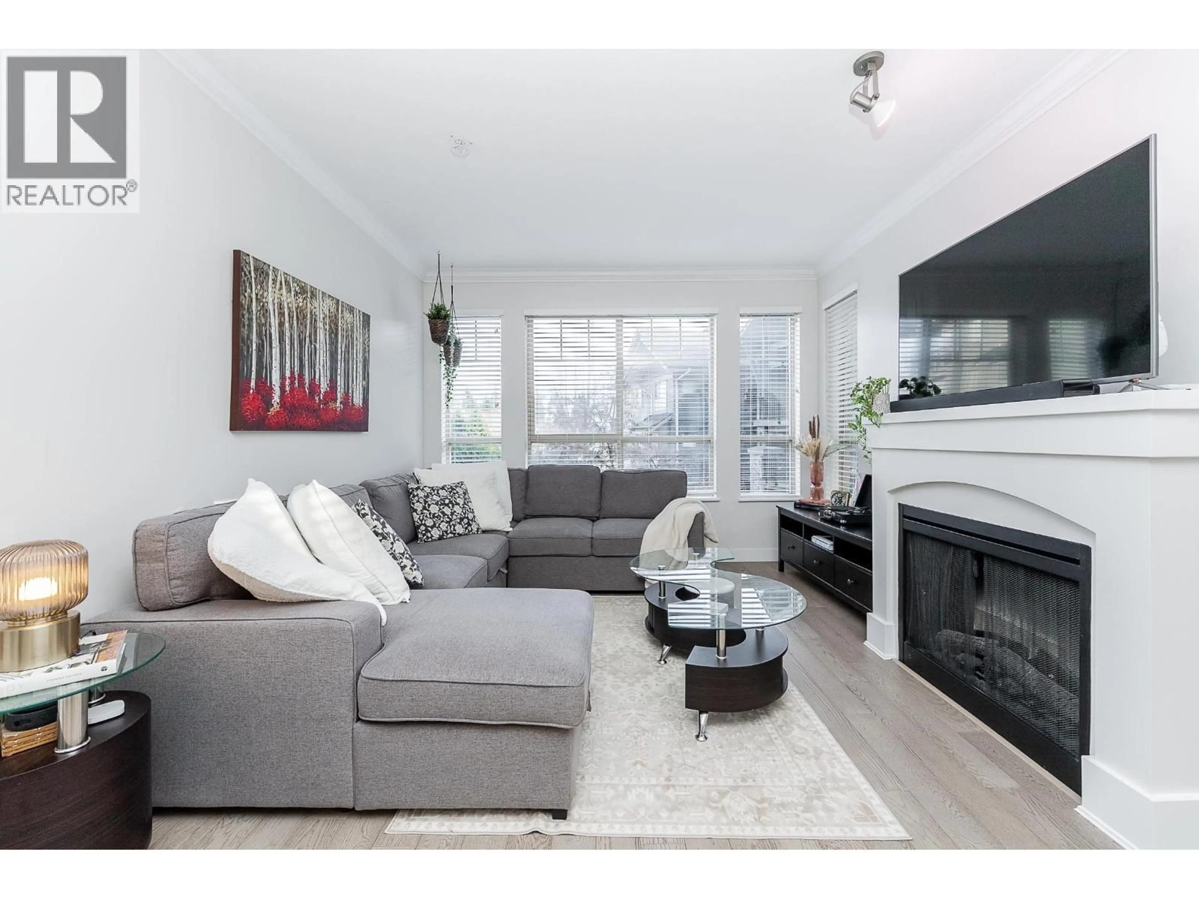 Living room with furniture, wood/laminate floor for 208 - 2969 WHISPER WAY, Coquitlam British Columbia V3E3S8