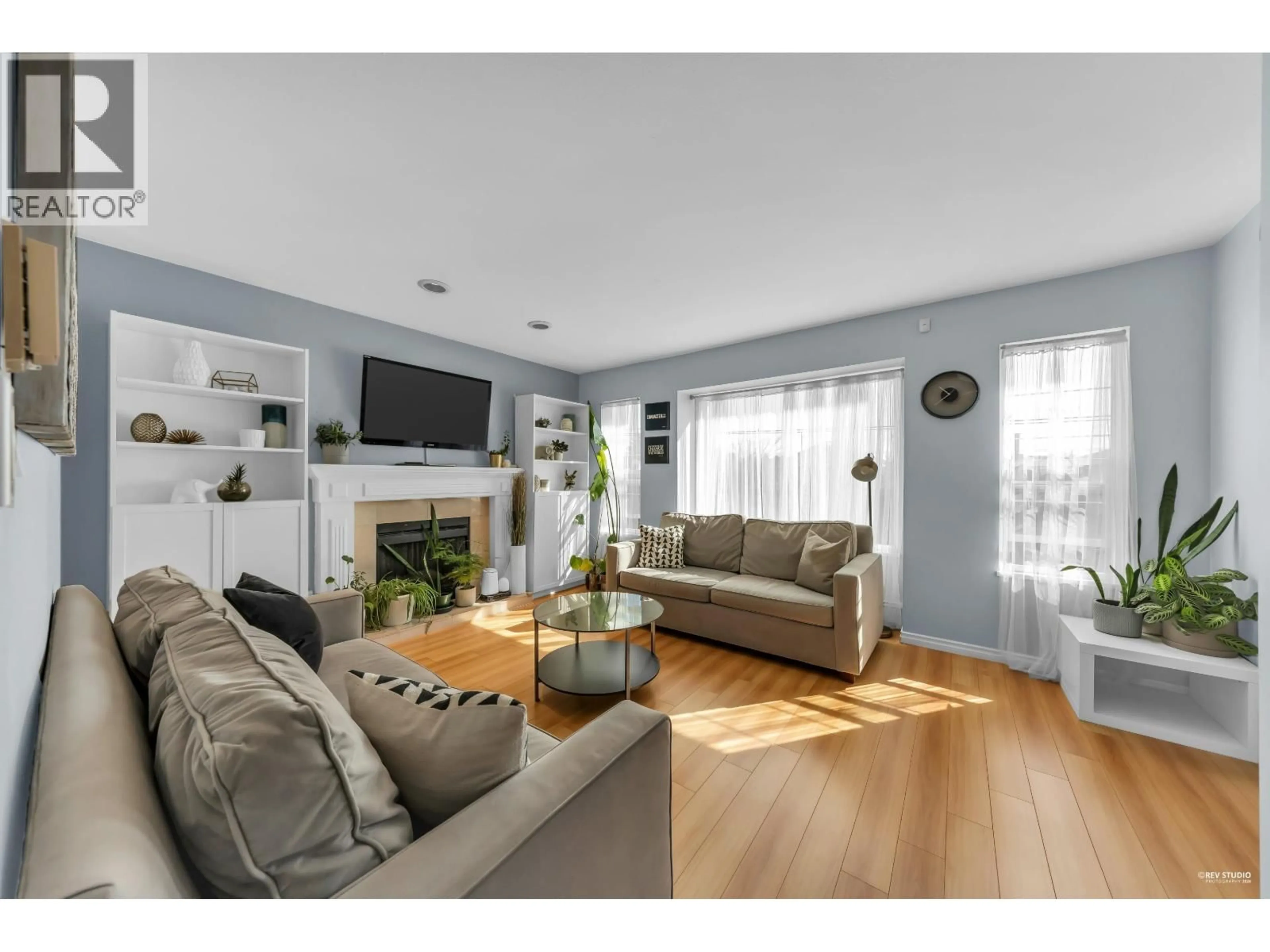 Living room with furniture, wood/laminate floor for 7125 MAIN STREET, Vancouver British Columbia V5X3J1