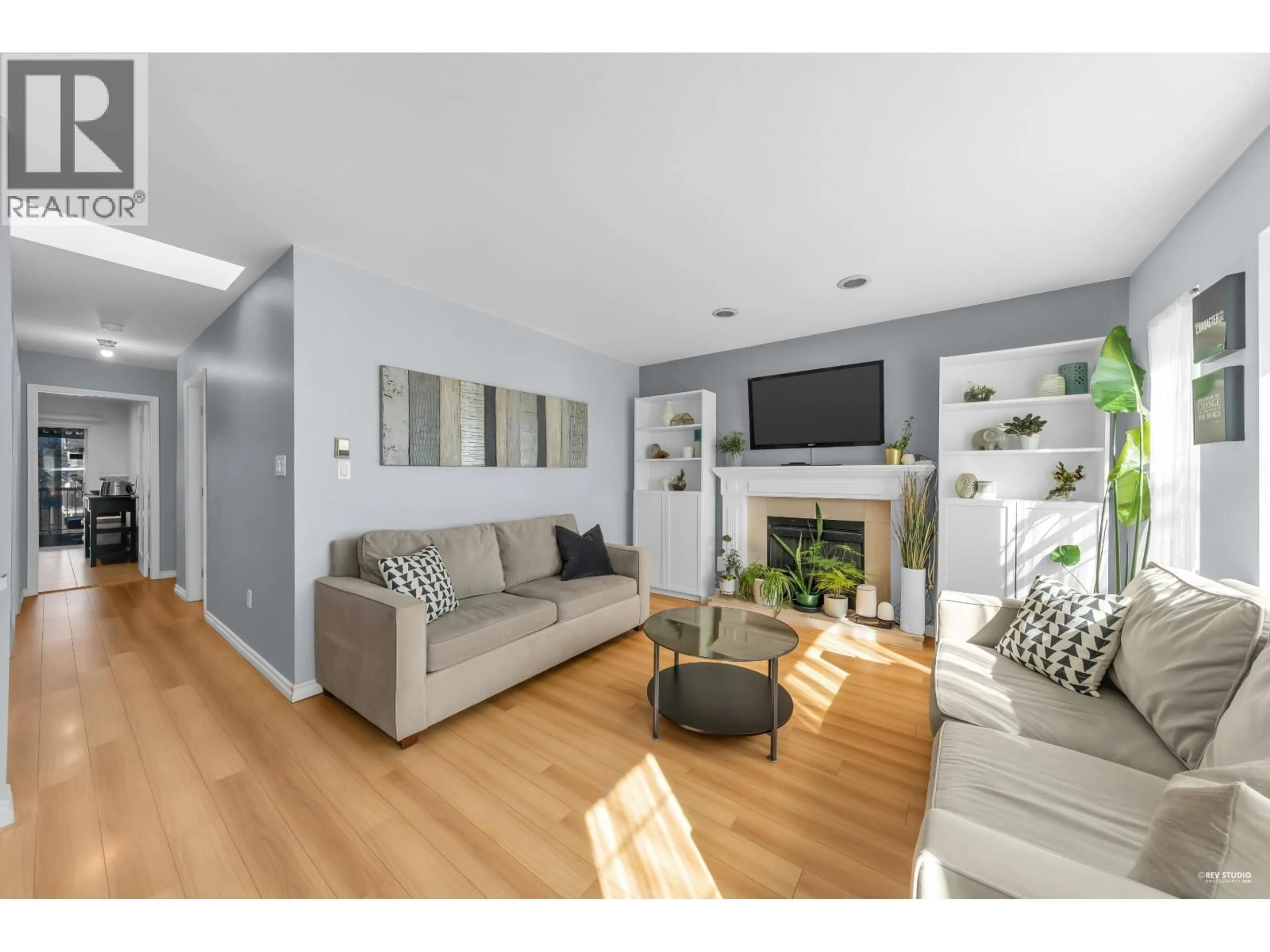 Living room with furniture, wood/laminate floor for 7125 MAIN STREET, Vancouver British Columbia V5X3J1