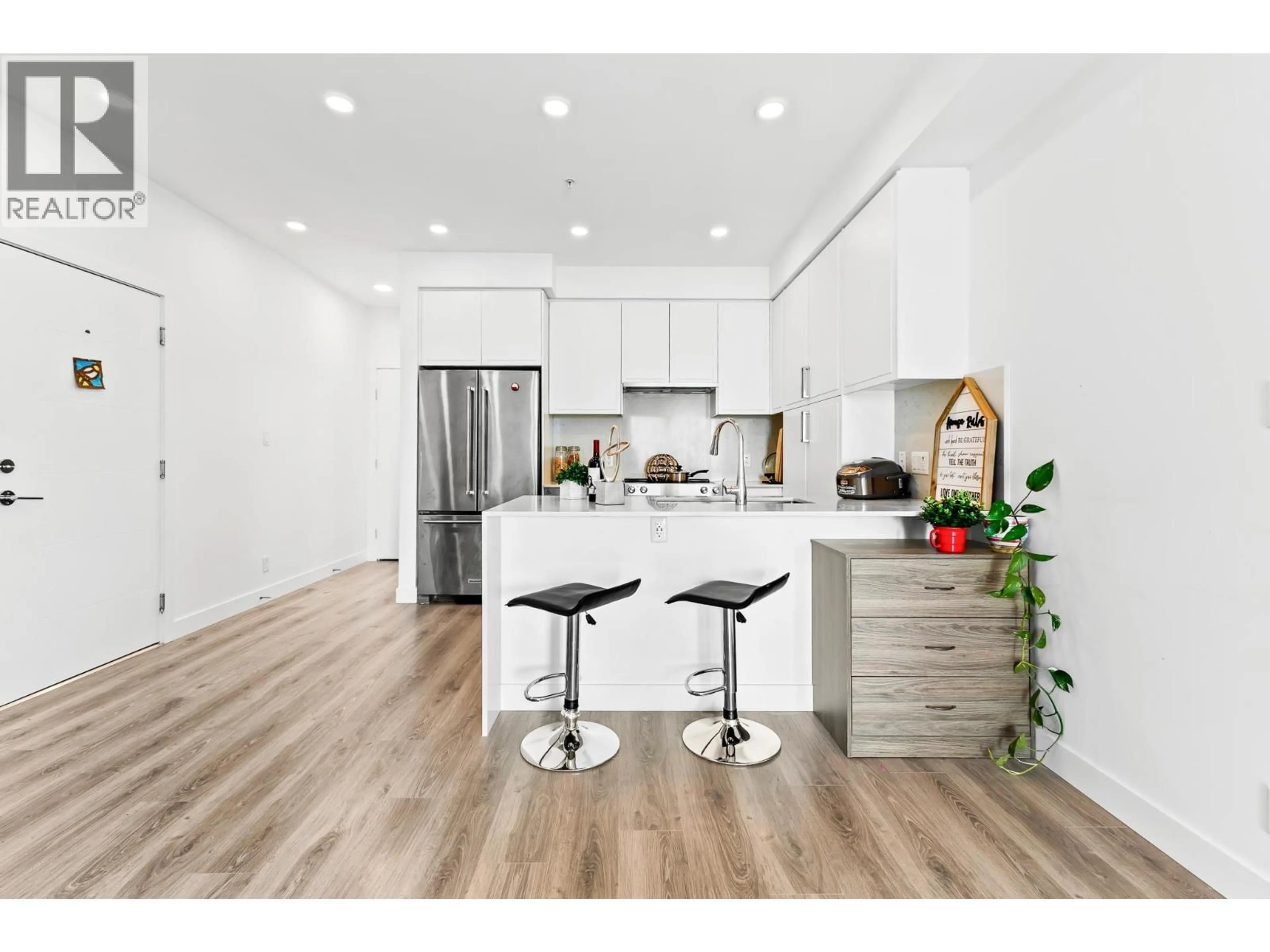 Open concept kitchen, wood/laminate floor for 505 - 700 CLARKE ROAD, Coquitlam British Columbia V3J0K5