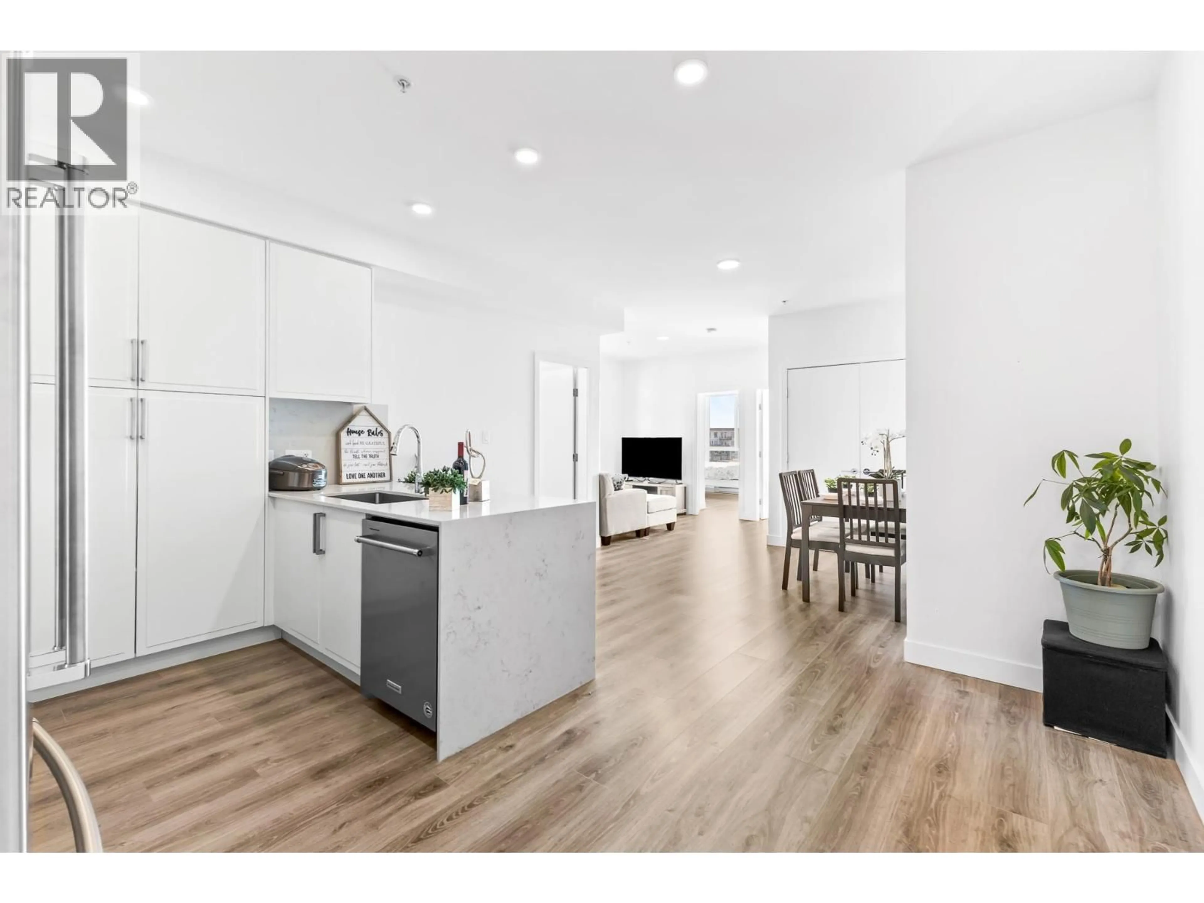 Open concept kitchen, wood/laminate floor for 505 - 700 CLARKE ROAD, Coquitlam British Columbia V3J0K5
