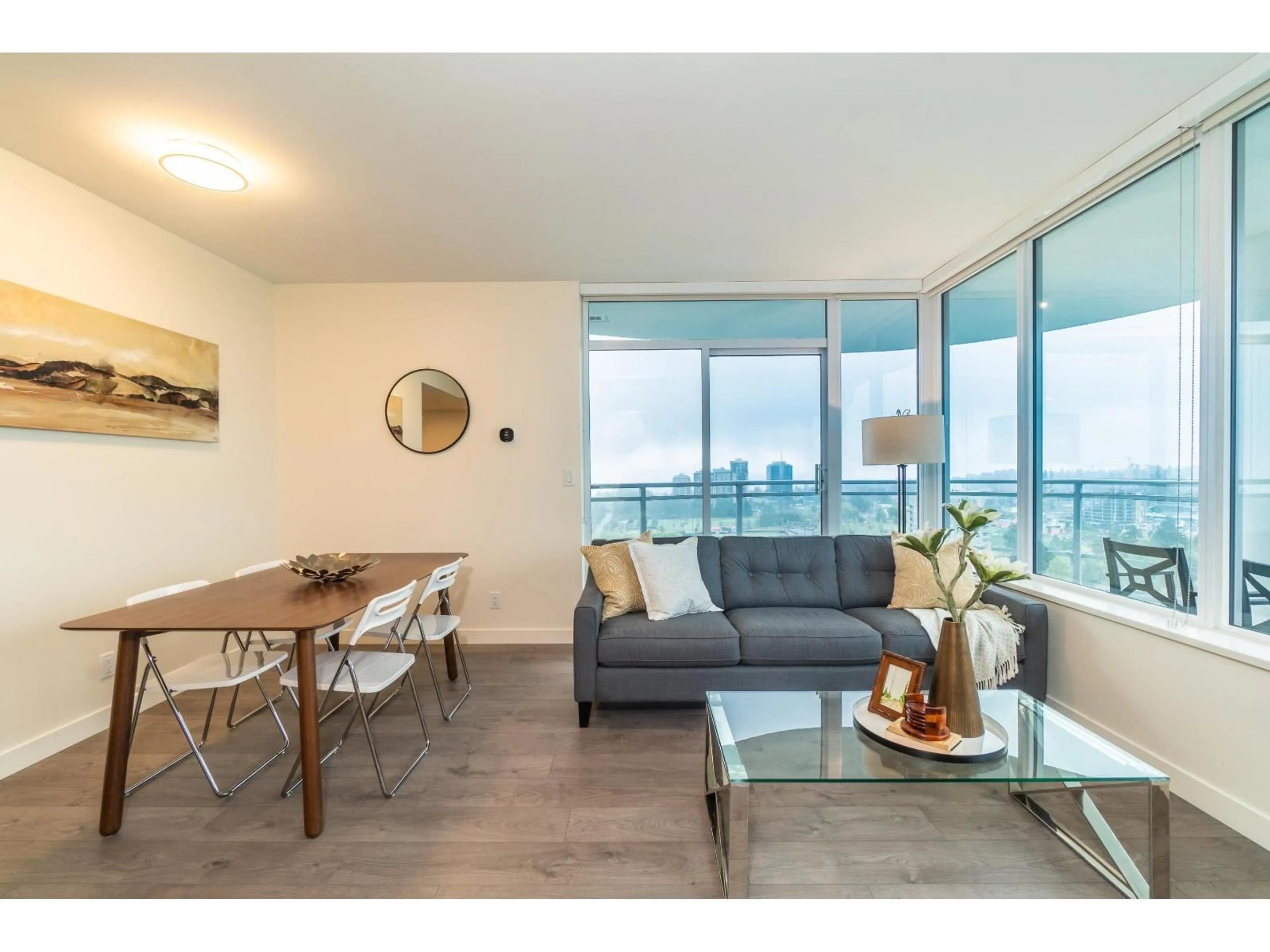 Living room with furniture, wood/laminate floor for 1703 - 13318 104 AVENUE, Surrey British Columbia V3T0R2